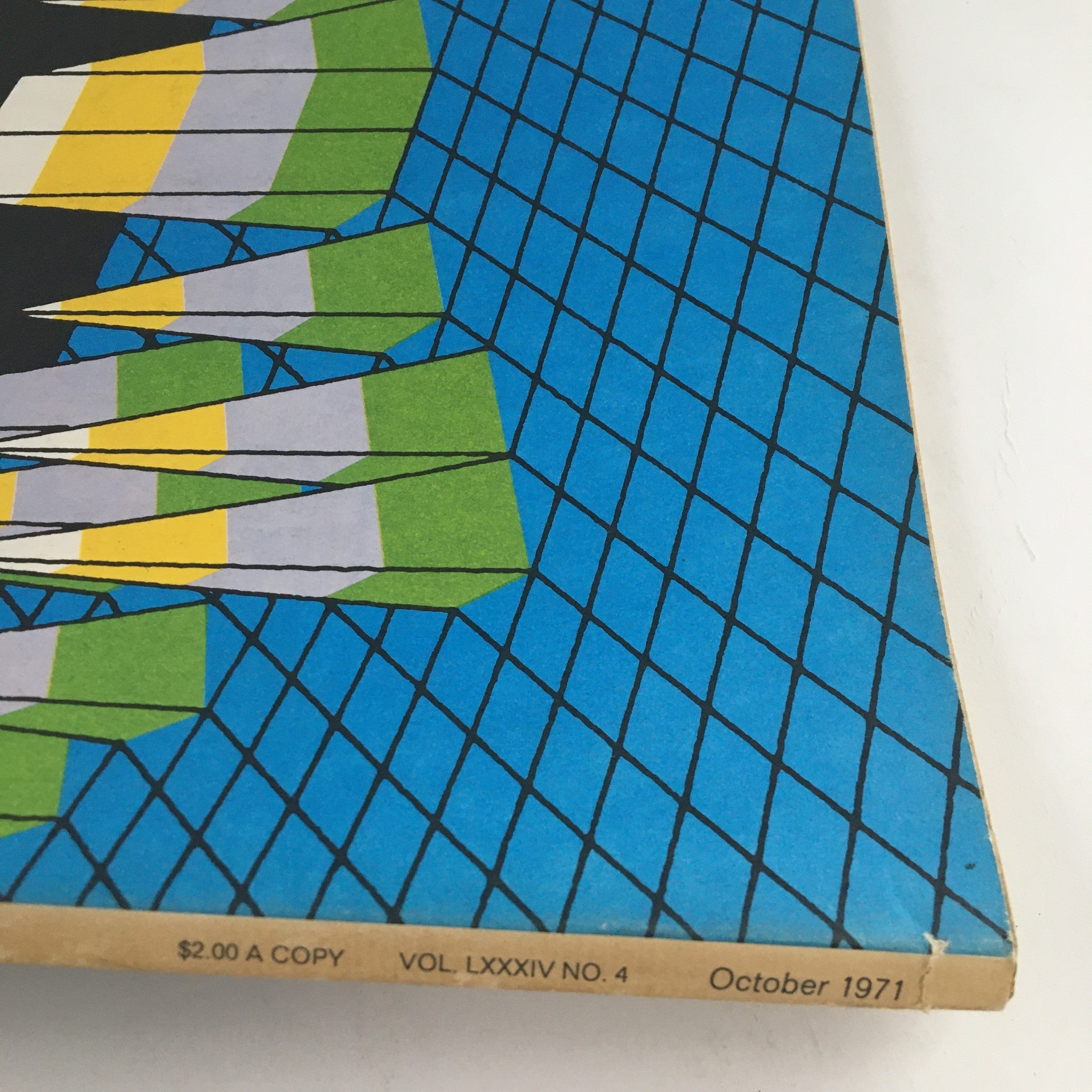 Close-up view of the spine of Fortune Magazine October 1971 displaying the issue number and price along with a visual of geometric peaks against a blue grid design.