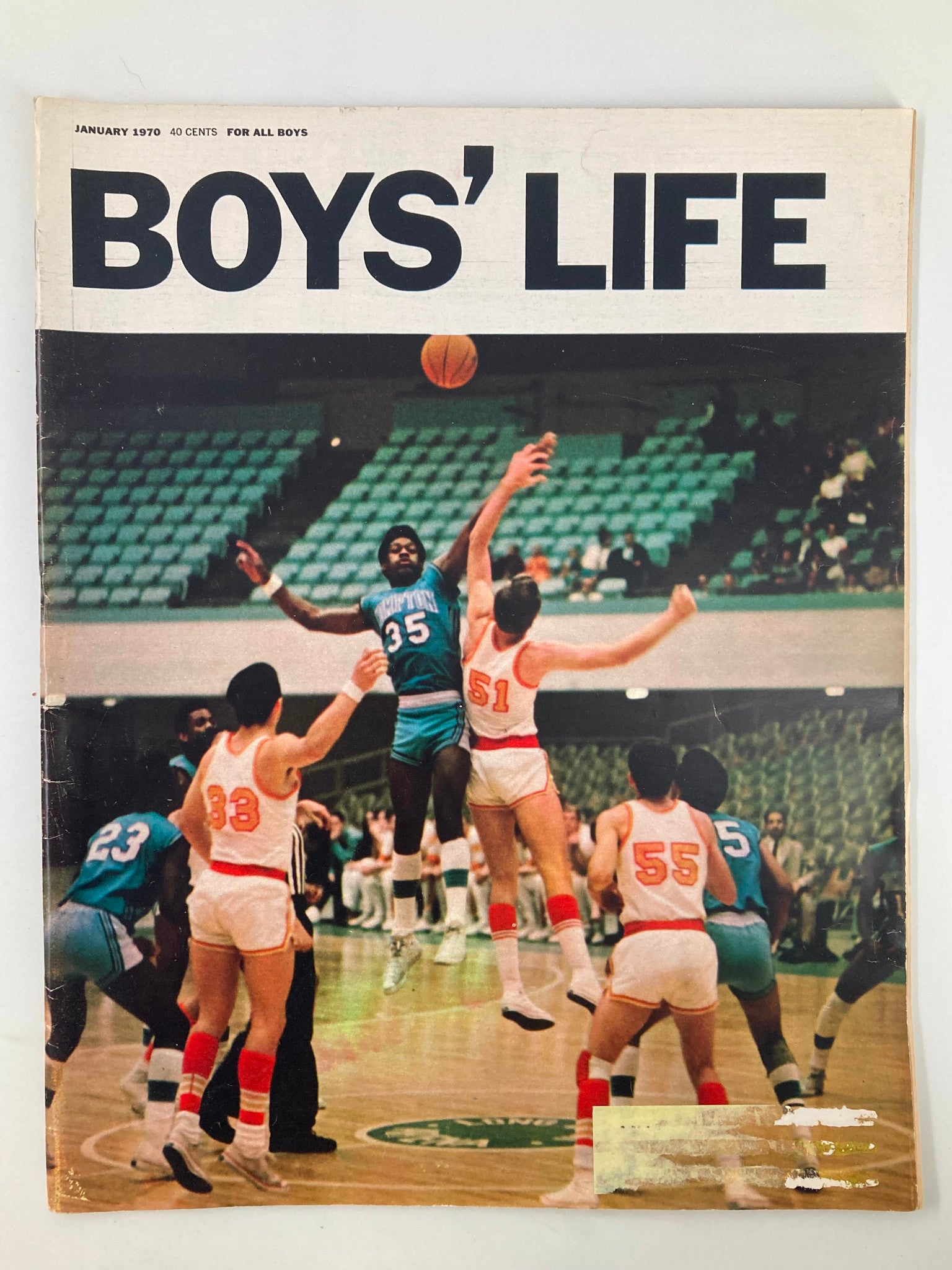 Boys' Life Magazine January 1970 cover featuring basketball players in action during a game, showcasing the vibrant and dynamic spirit of youth sports.