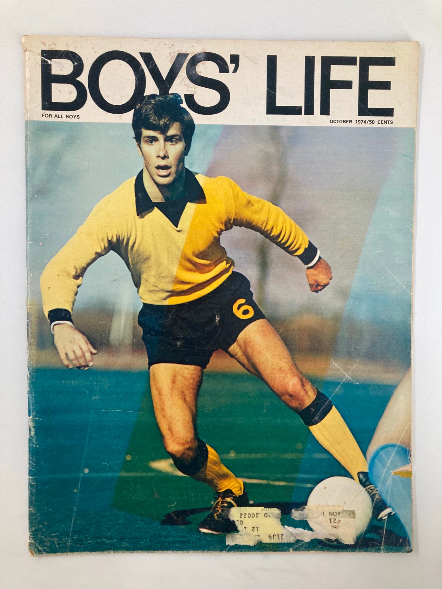 Cover of VTG Boys' Life Magazine, October 1974, featuring a football player in a yellow and black uniform, highlighting the article 'The Real Football' by James Lincoln Collier.