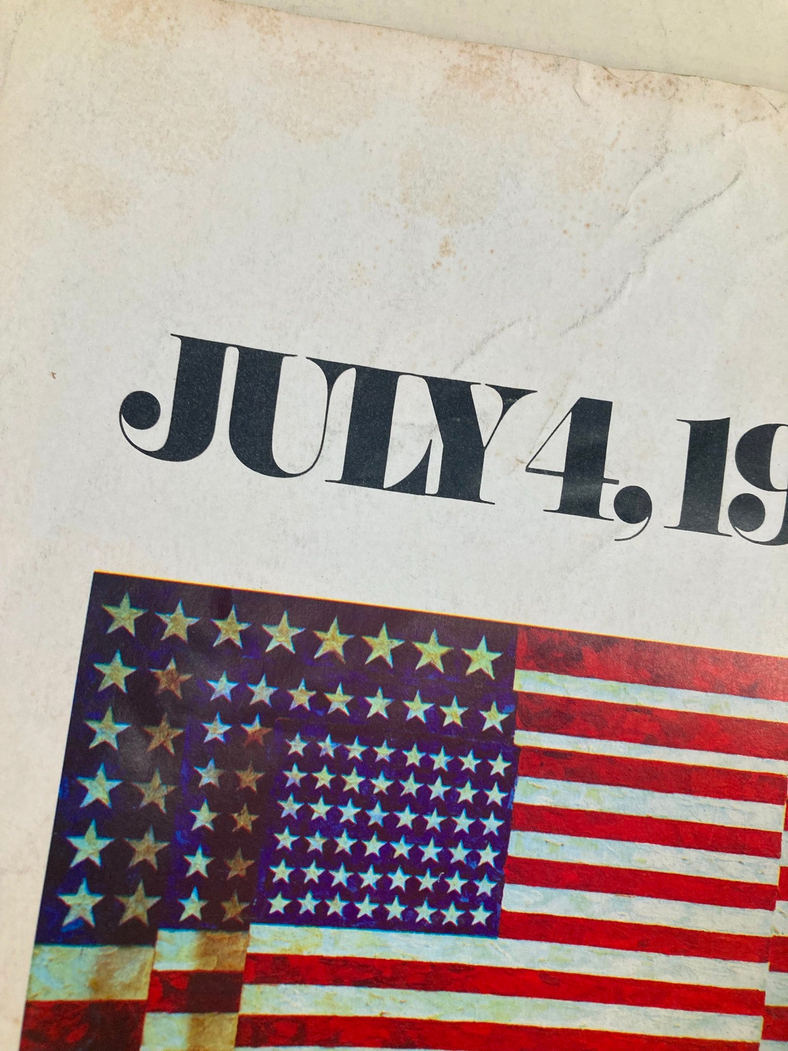Detailed view of the cover of the Vintage The Washington Post Magazine July 4 1976, highlighting the title and American flag design with signs of age.