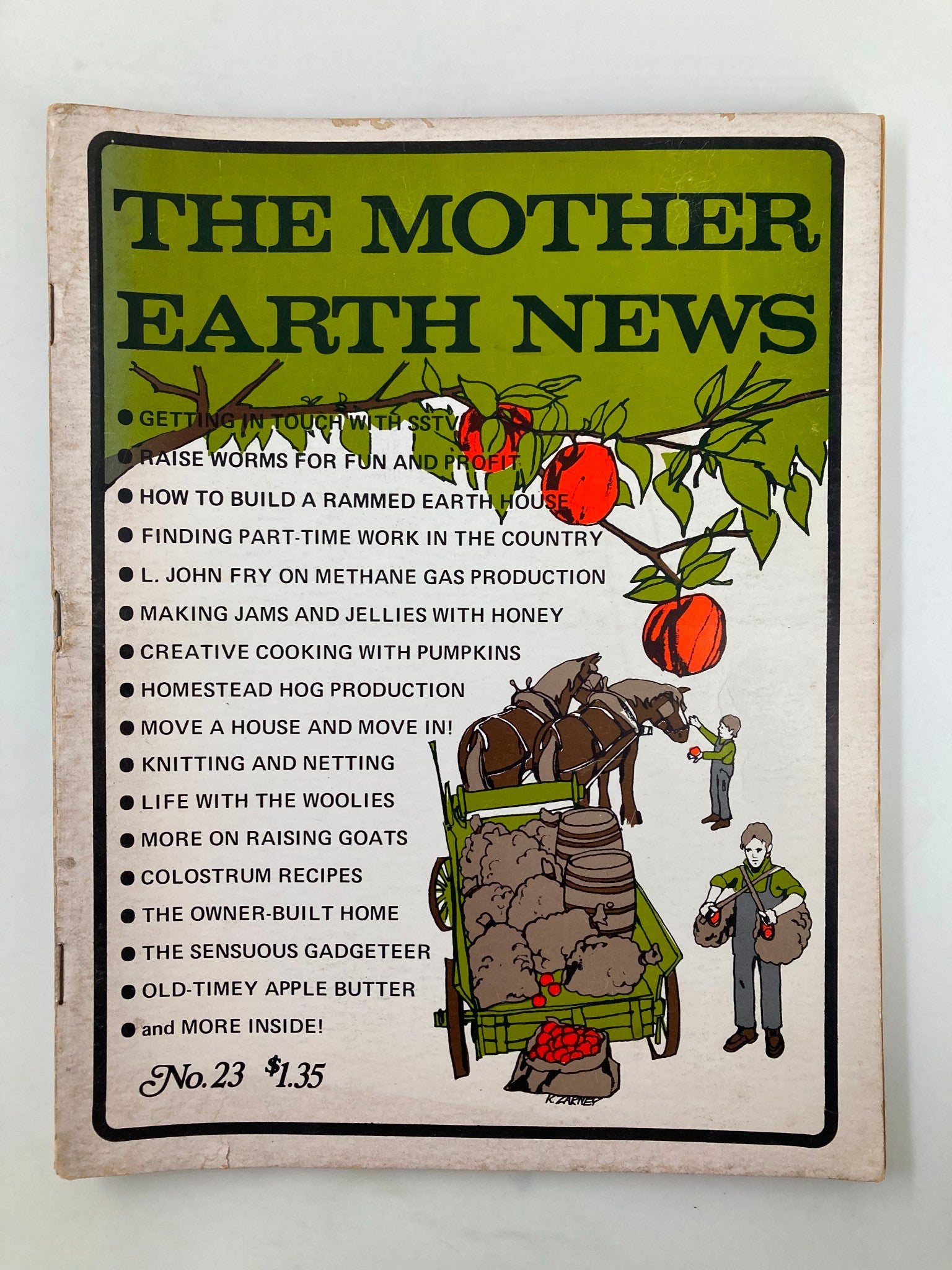 Cover of VTG The Mother Earth News Magazine September 1973 issue #23 featuring illustrations of homesteading activities, including Old-Timey Apple Butter, and a colorful depiction of traditional farming scenes with apples and a horse-drawn cart.