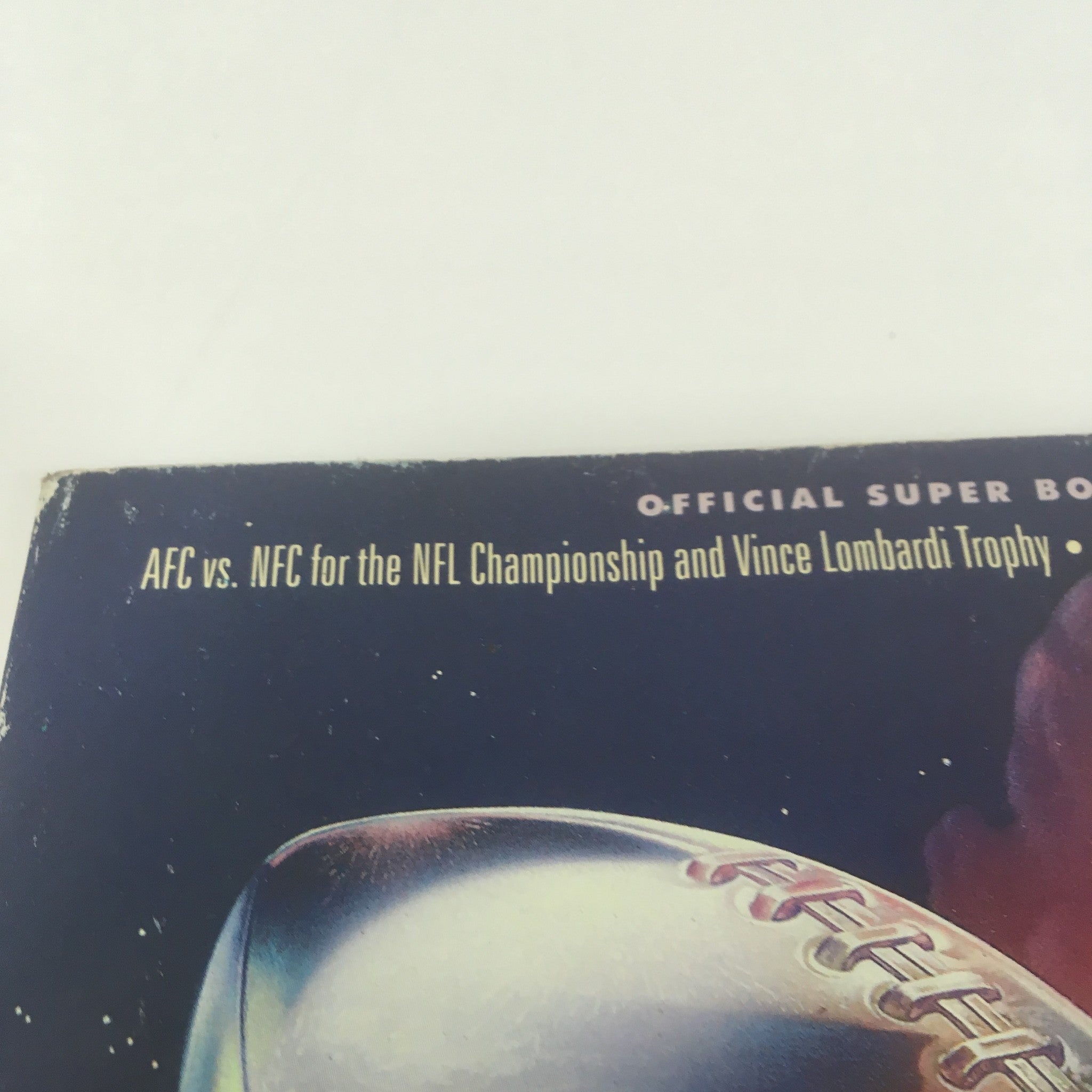 Top section of the Super Bowl XXVI Game Program, dated January 26, 1992, detailing the AFC vs. NFC championship match and the Vince Lombardi Trophy.