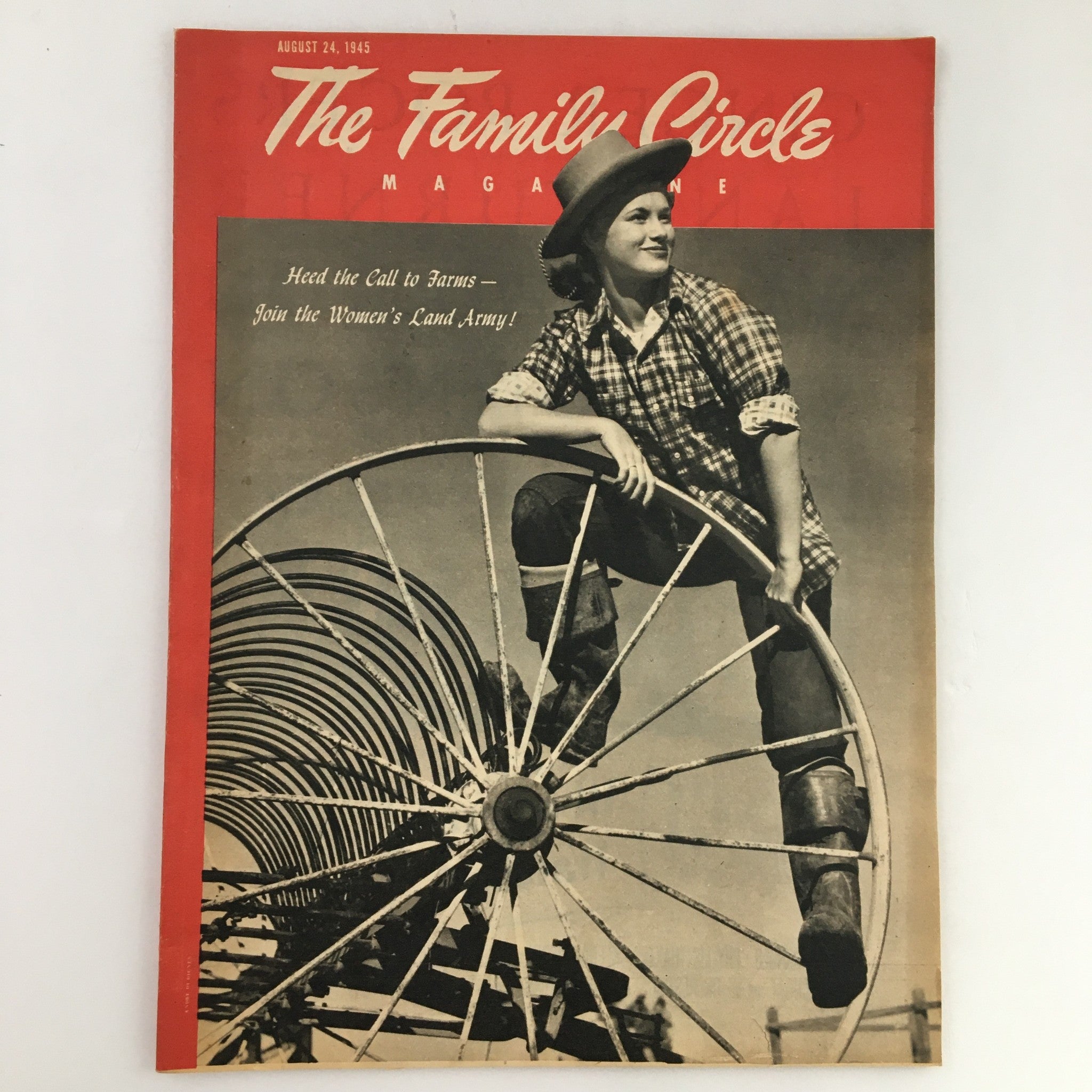 The Family Circle Magazine August 24 1945 cover featuring a woman in work attire on a farm machinery wheel, emphasizing the theme 'Head the Call to Farms - Join the Women's Land Army.'