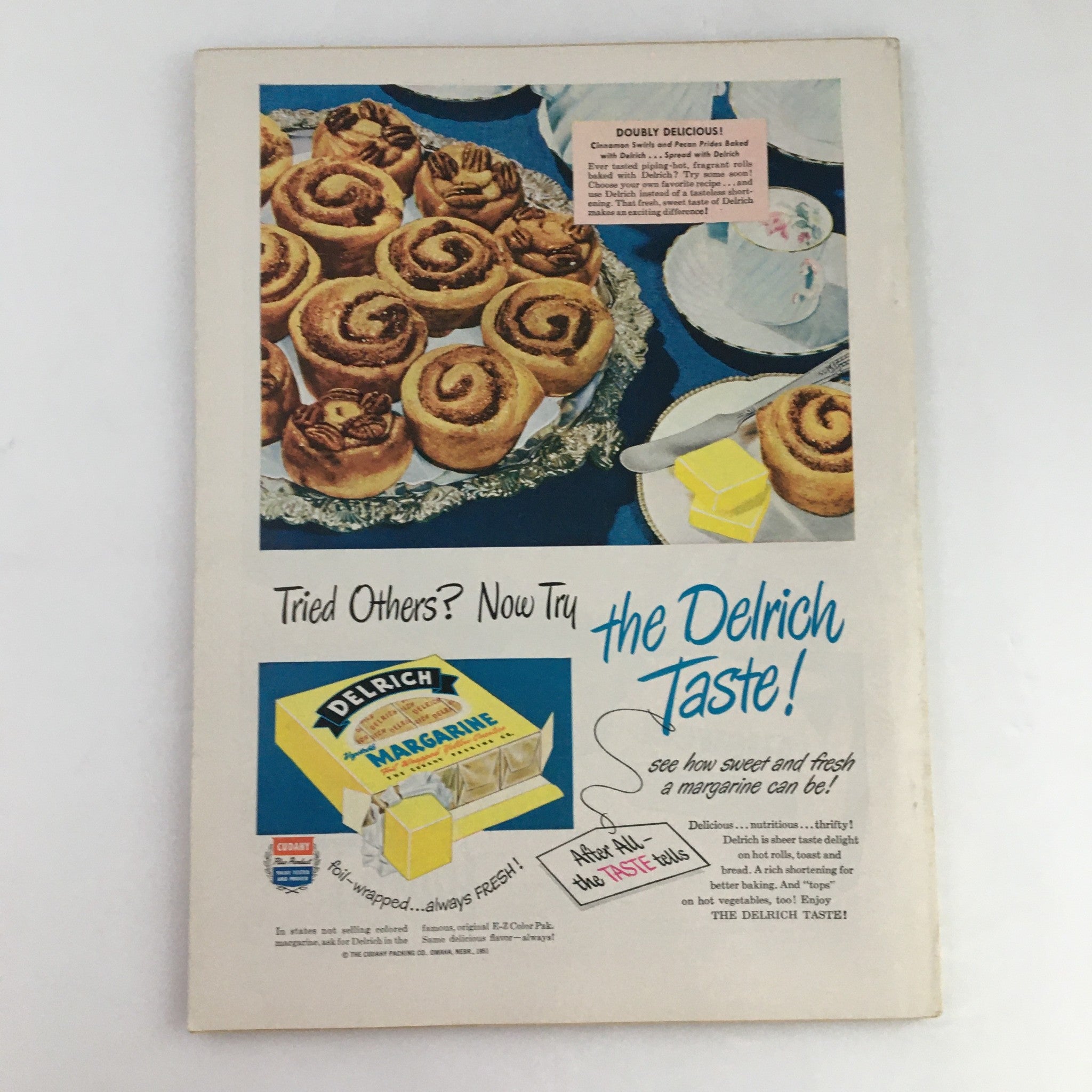 Back cover of The Family Circle Magazine April 1951 featuring an advertisement for Delrich margarine alongside an image of cinnamon rolls, highlighting mid-century food marketing.