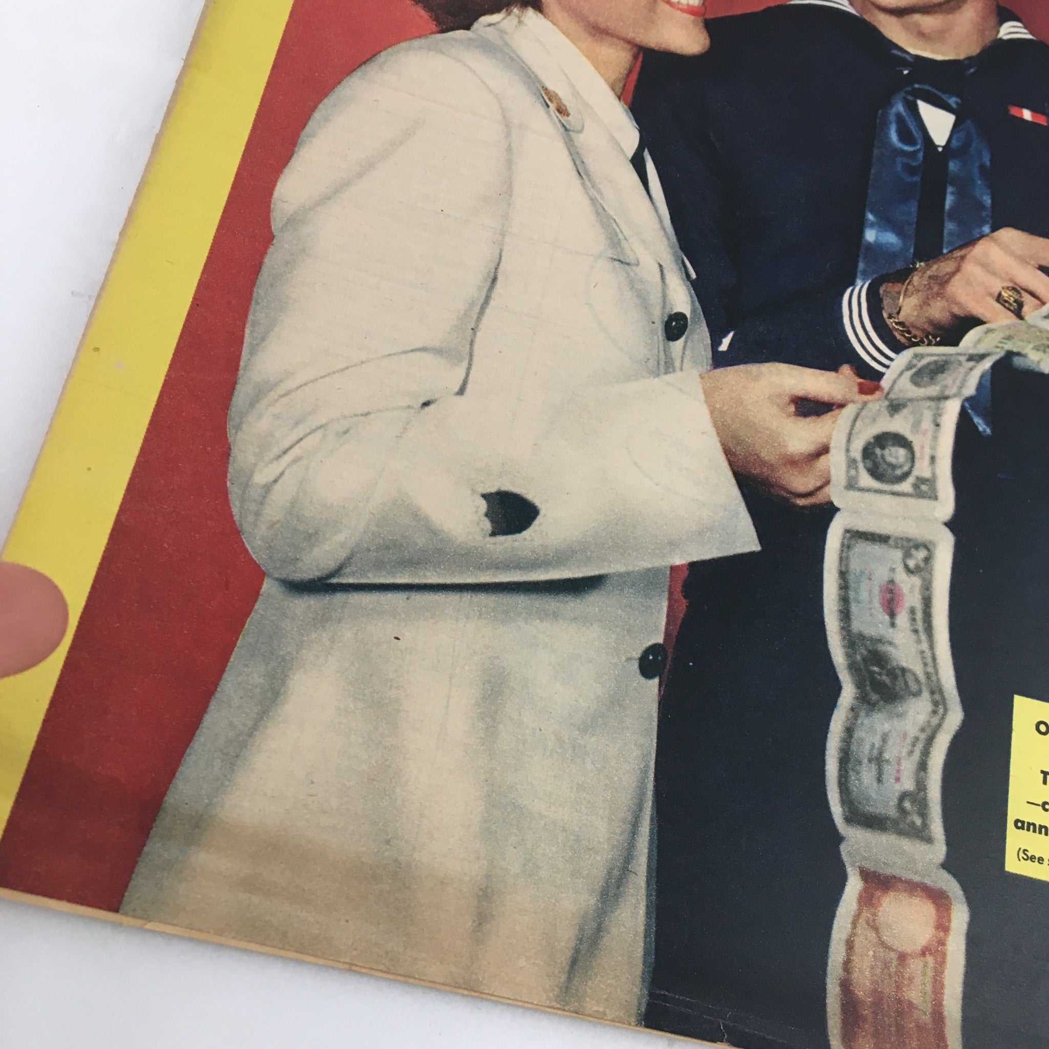 Close-up of The Family Circle Magazine - August 3, 1945 cover, highlighting the joyful interaction between a U.S. Navy sailor and a servicewoman, with attention to the anniversary mention of the Coast Guard.