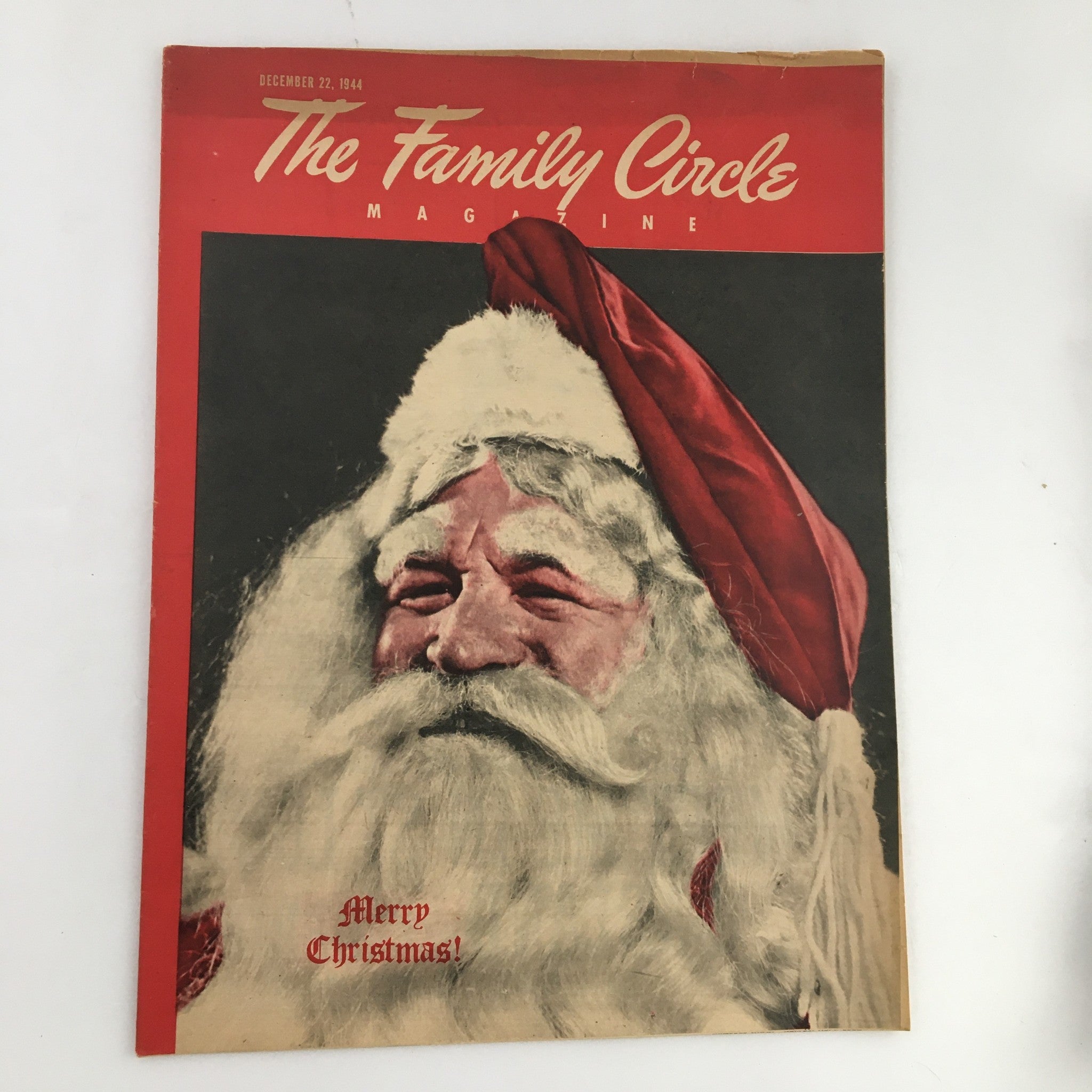 The Family Circle Magazine December 22, 1944 cover featuring Santa Claus with a joyful expression and a red Santa hat, captioned 'Merry Christmas!'. A vintage magazine perfect for holiday collectors.