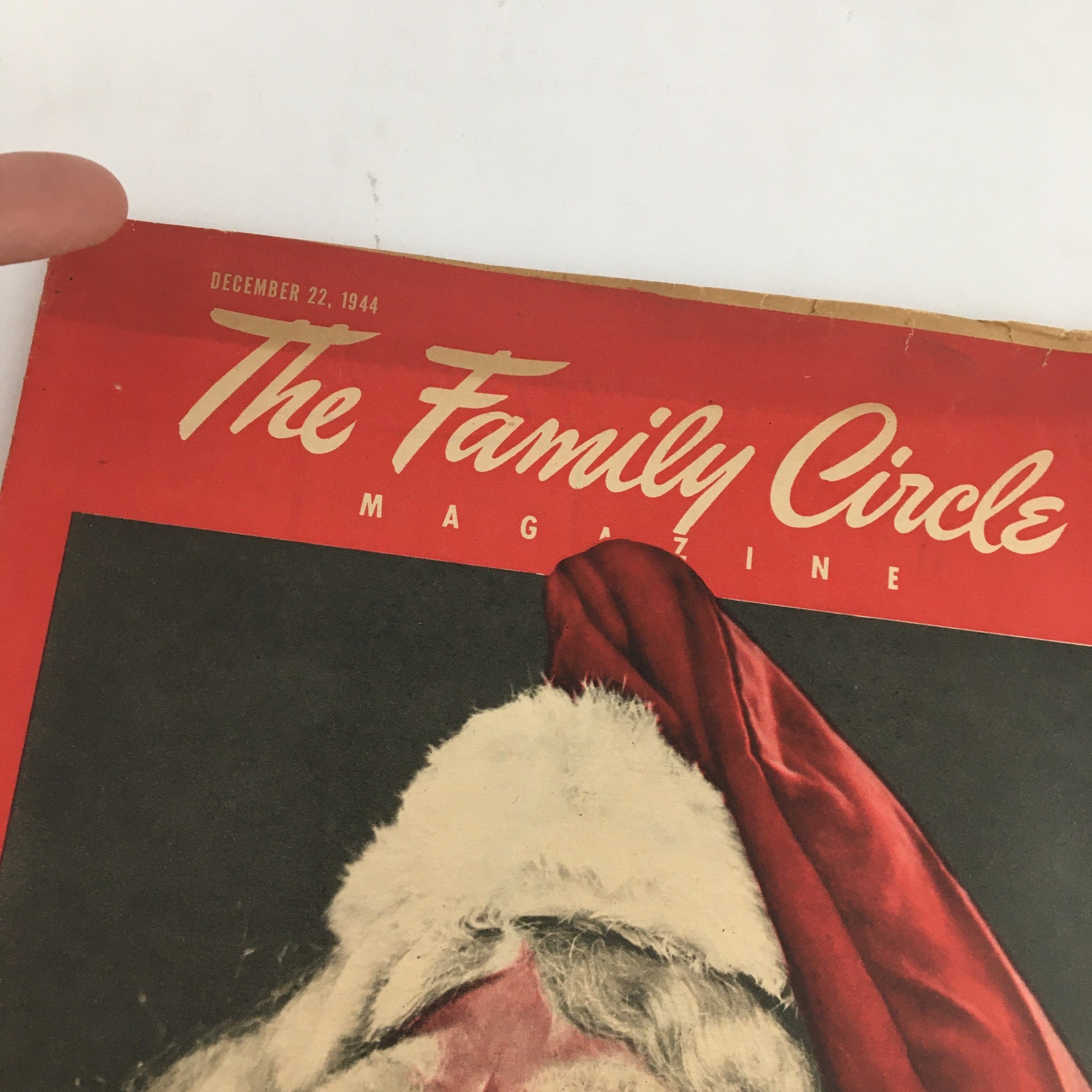 Close-up of The Family Circle Magazine December 22, 1944 cover, showing the title and date prominently above Santa Claus's smiling face, ideal for vintage magazine enthusiasts.