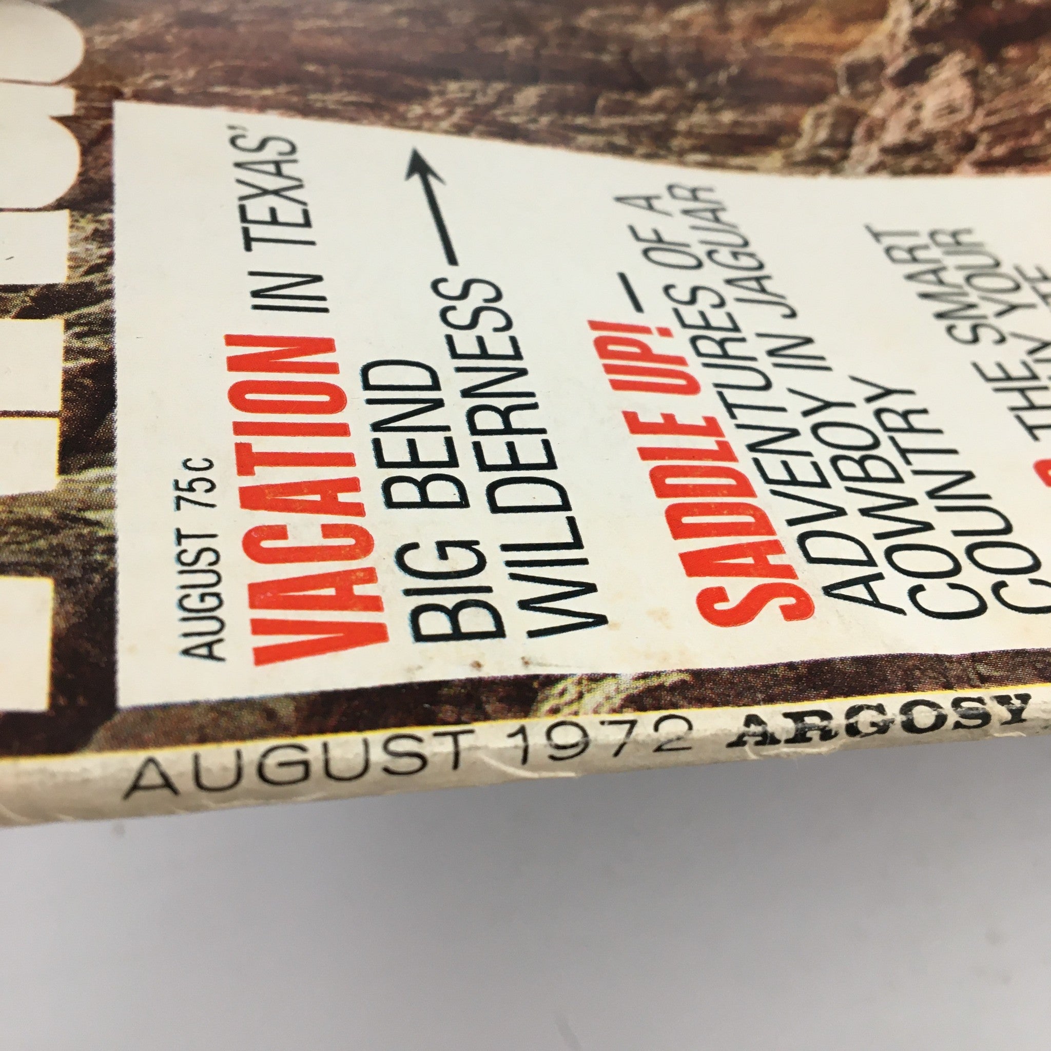 Close-up of the Argosy Magazine August 1972 cover, showcasing the title and featured articles about vacationing in Texas and adventures in the Big Bend Wilderness.