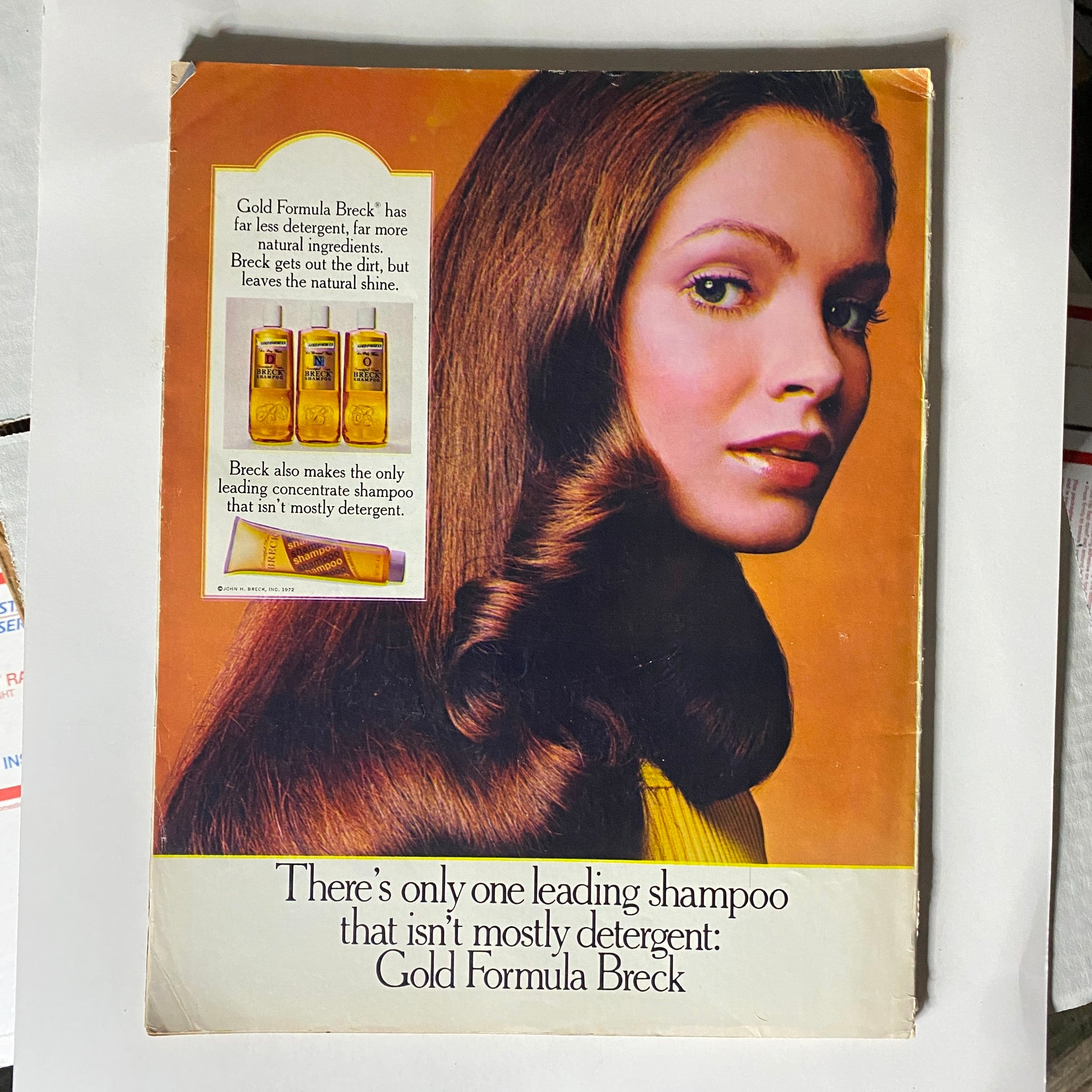 Back cover of VTG Seventeen Magazine July 1972 displaying an advertisement for Gold Formula Breck shampoo, featuring a model with long hair and highlighting the product's benefits.