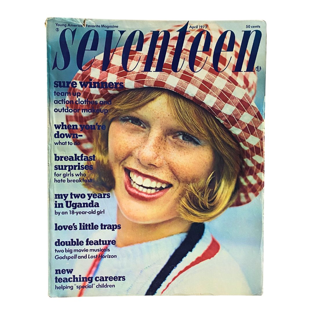 Cover of VTG Seventeen Magazine April 1973 featuring an article titled 'My Two Years in Uganda,' showcasing a smiling young woman in a red and white checked hat, embodying the fashion and culture of the early 1970s.