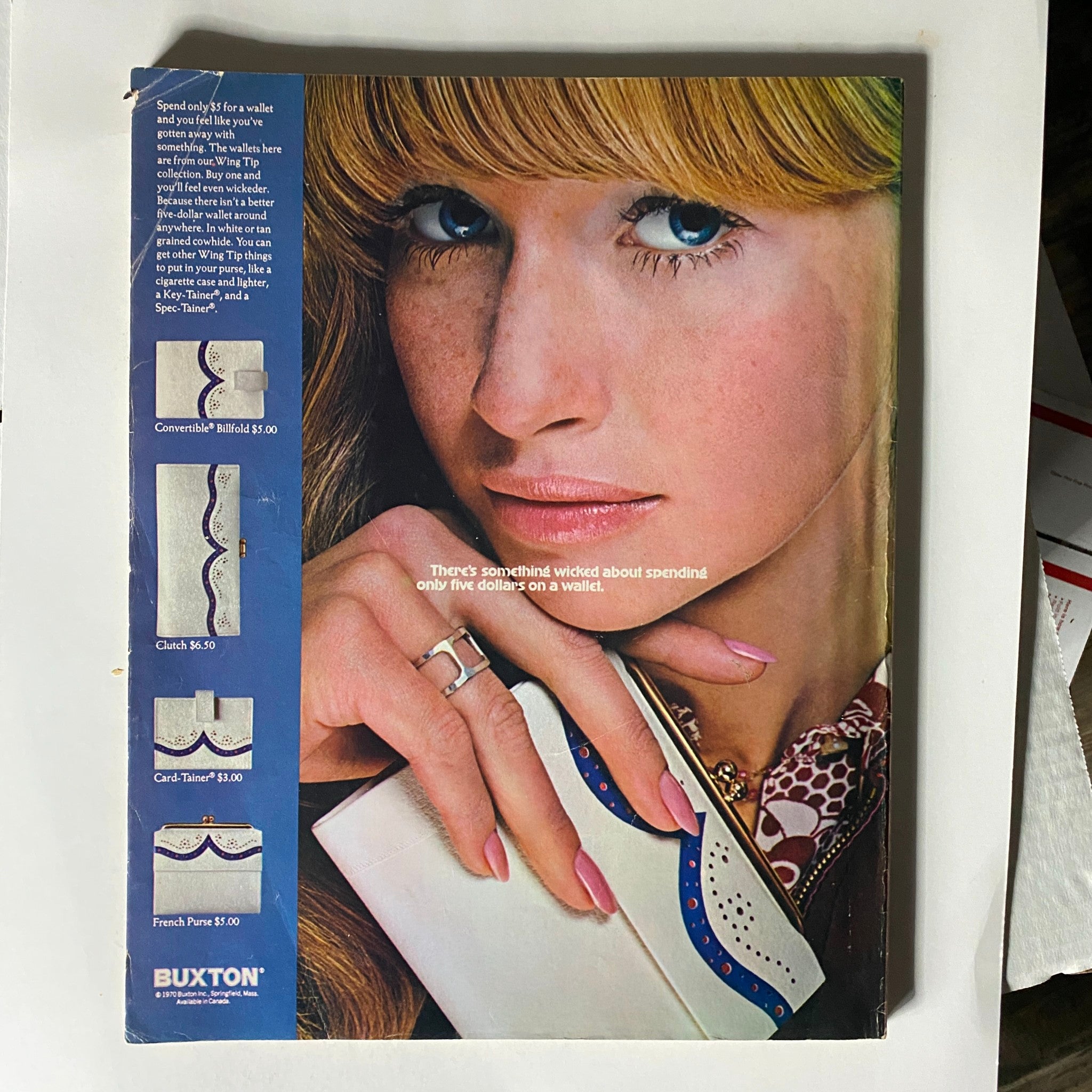 Back cover of VTG Seventeen Magazine May 1970 featuring an advertisement for Buxton wallets alongside a close-up of a model's face, complementing the magazine's vintage fashion theme.