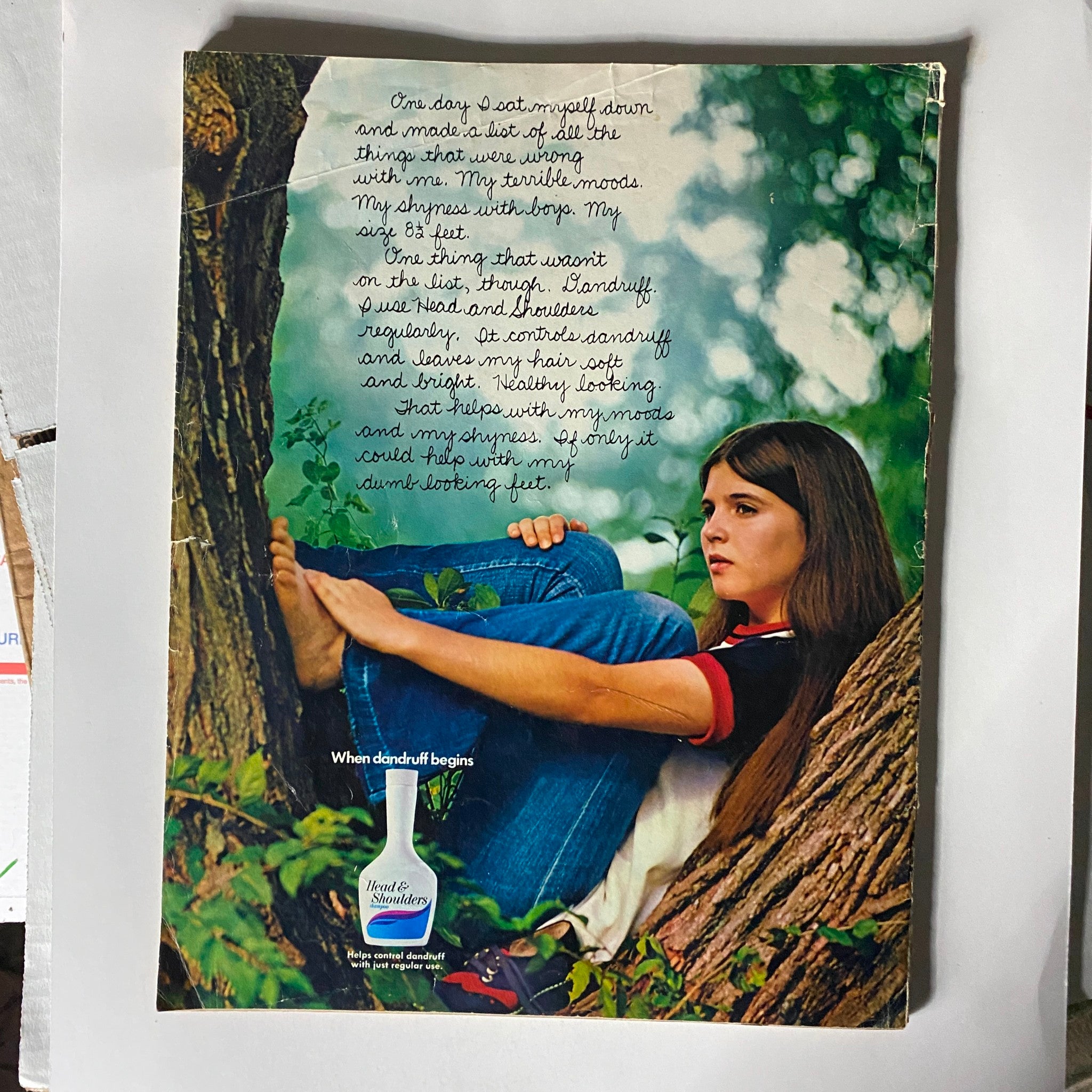 Back cover of the VTG Seventeen Magazine June 1972 featuring a young girl sitting against a tree. The image includes handwritten text discussing personal reflections and a bottle of Head and Shoulders shampoo. This is part of a collectible magazine featuring Robert Redford.