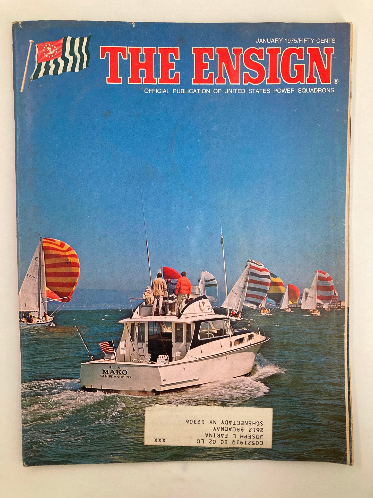 VTG The Ensign Magazine January 1975 featuring a sailboat and colorful sails on the water, showcasing nautical adventures and boating culture.