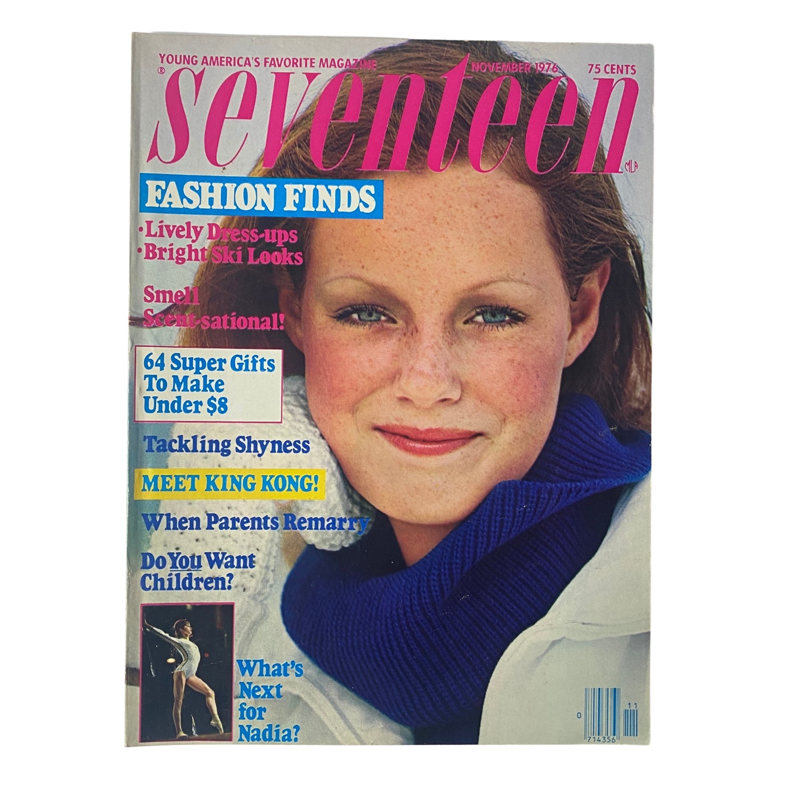 Seventeen Magazine Cover from November 1976 featuring a young model with a blue sweater, highlighting fashion finds and featuring a Nadia Comăneci article. Vintage teen magazine collectible.