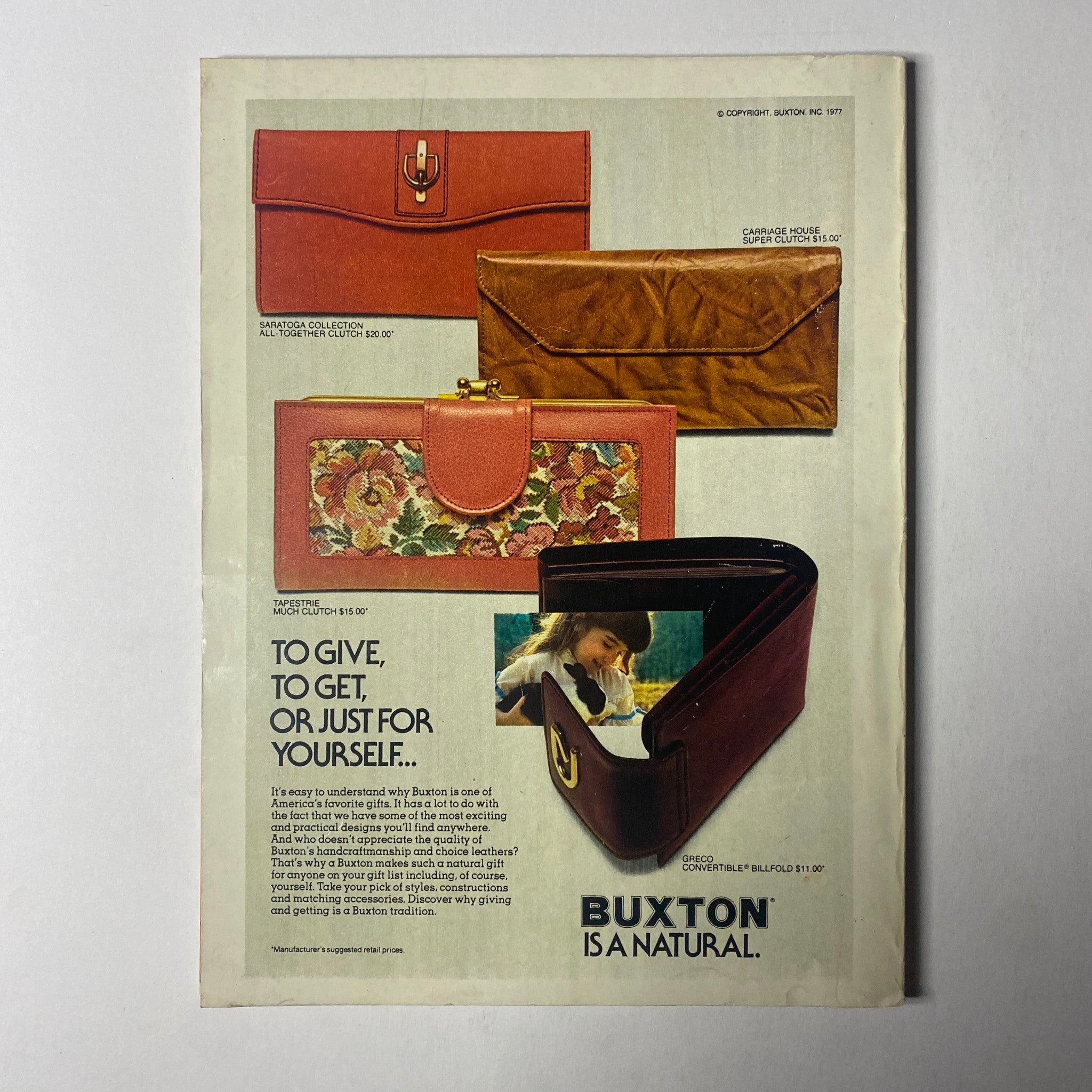 Back cover of Seventeen Magazine December 1977 featuring a colorful advertisement for Buxton wallets, emphasizing gifting options. This ad highlights the magazine's vintage advertising style.