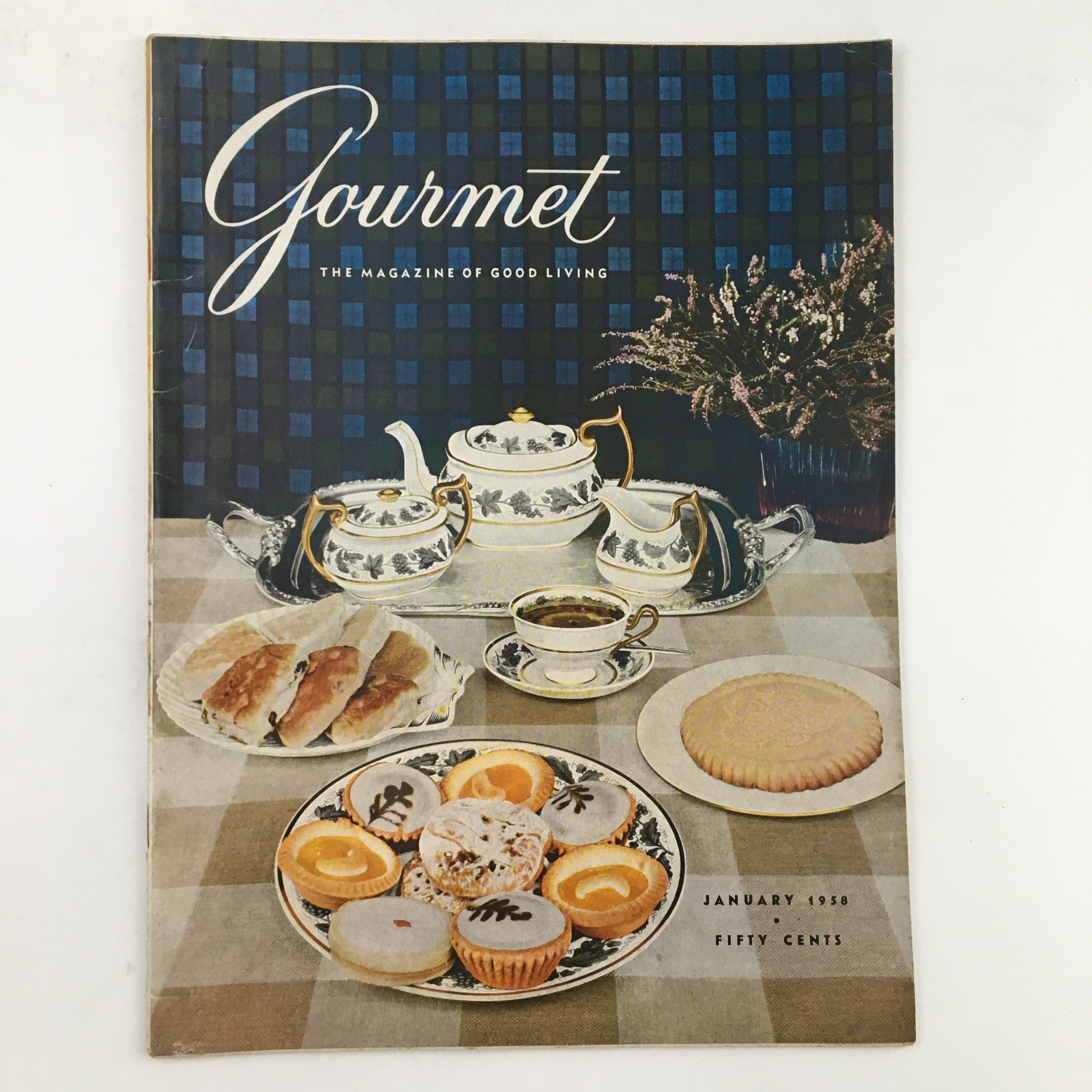 Cover of Gourmet Magazine January 1958 Vol. 18 No. 1 featuring a vintage table setting with tea, pastries, and decorative tableware.