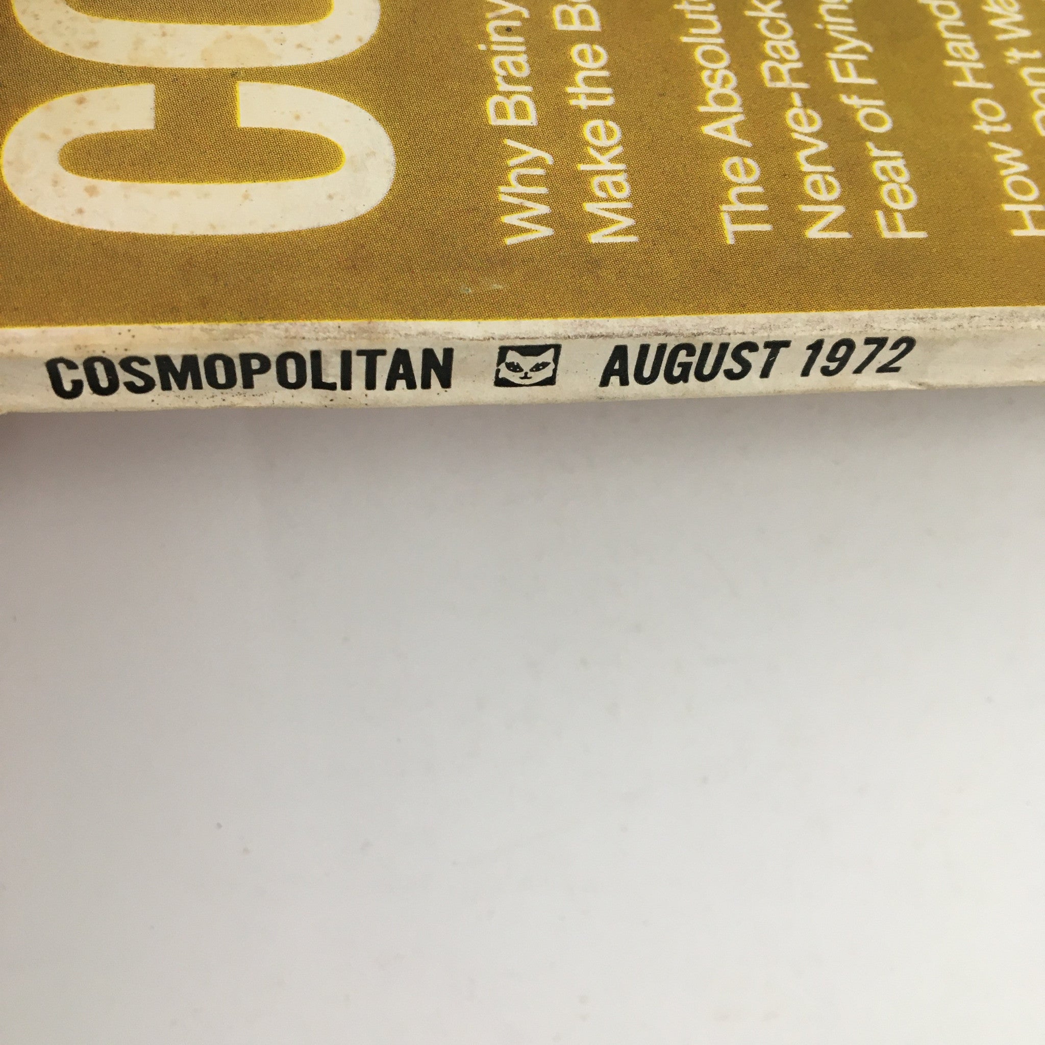 Spine of Cosmopolitan Magazine August 1972, displaying the magazine title and date, highlighting the issue's vintage appeal for collectors.