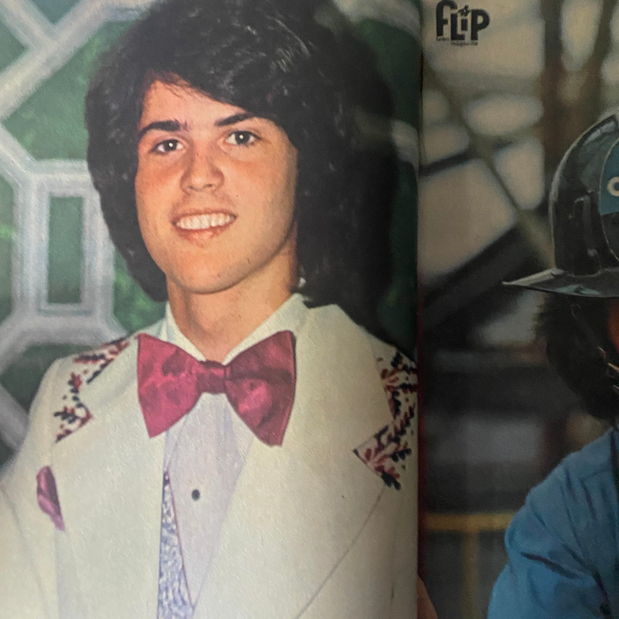 Close-up of a young male in a stylish suit from VTG Flip Teen Magazine February 1975 Donny Osmond, representing the fashion trends of the 1970s.