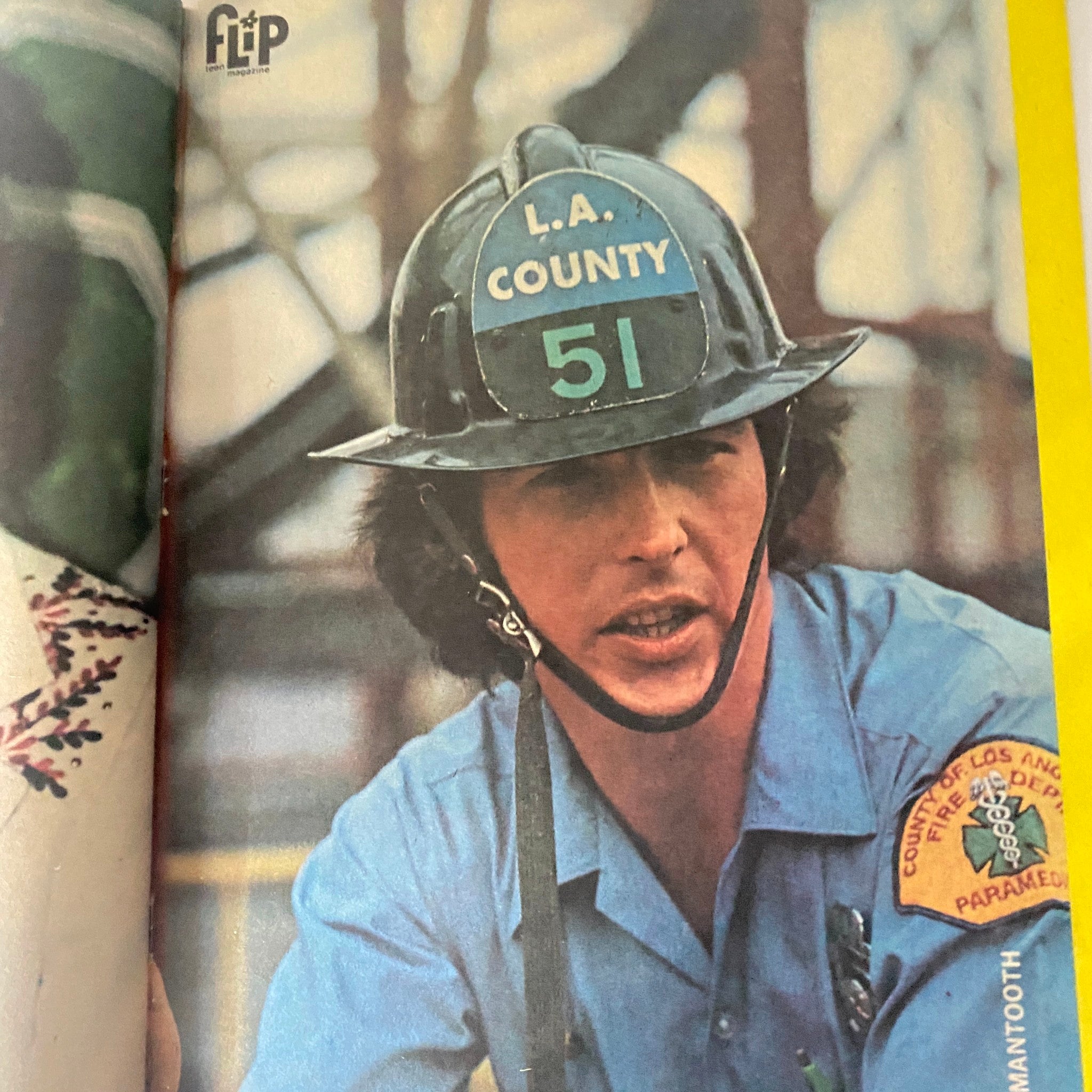 Young man wearing a firefighter helmet and uniform from VTG Flip Teen Magazine February 1975 Donny Osmond, highlighting 1970s emergency services themes.