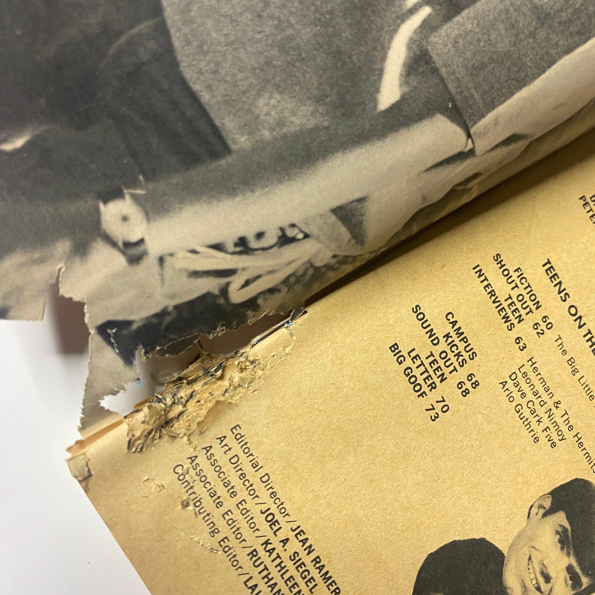 Detail of an inside page from Teen Datebook Magazine September 1968 showing creases and paper damage along the edge.