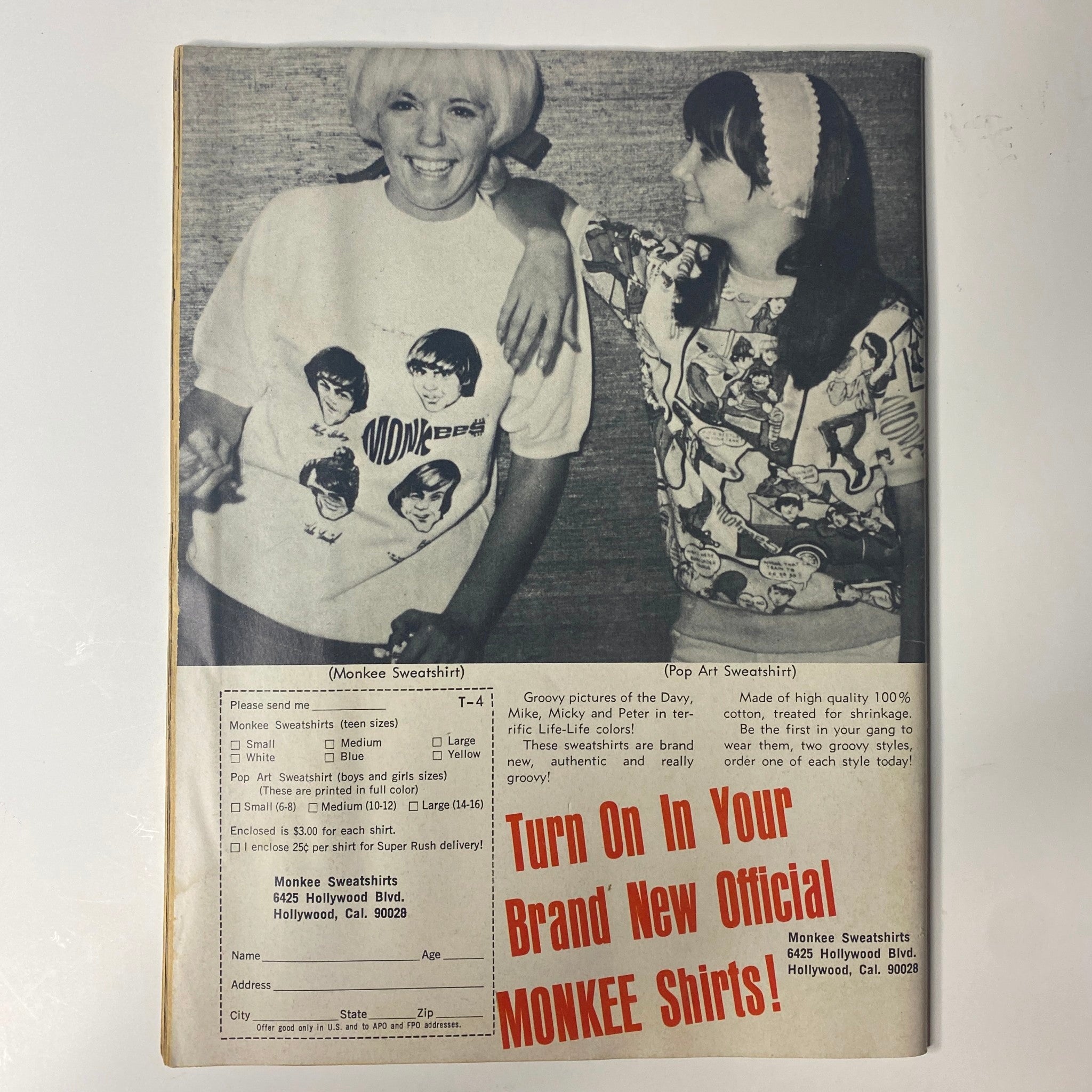 Back cover of Teen Screen Magazine April 1968 Vol 10 No. 4 advertising official Monkee shirts, featuring two young fans showcasing their merchandise.