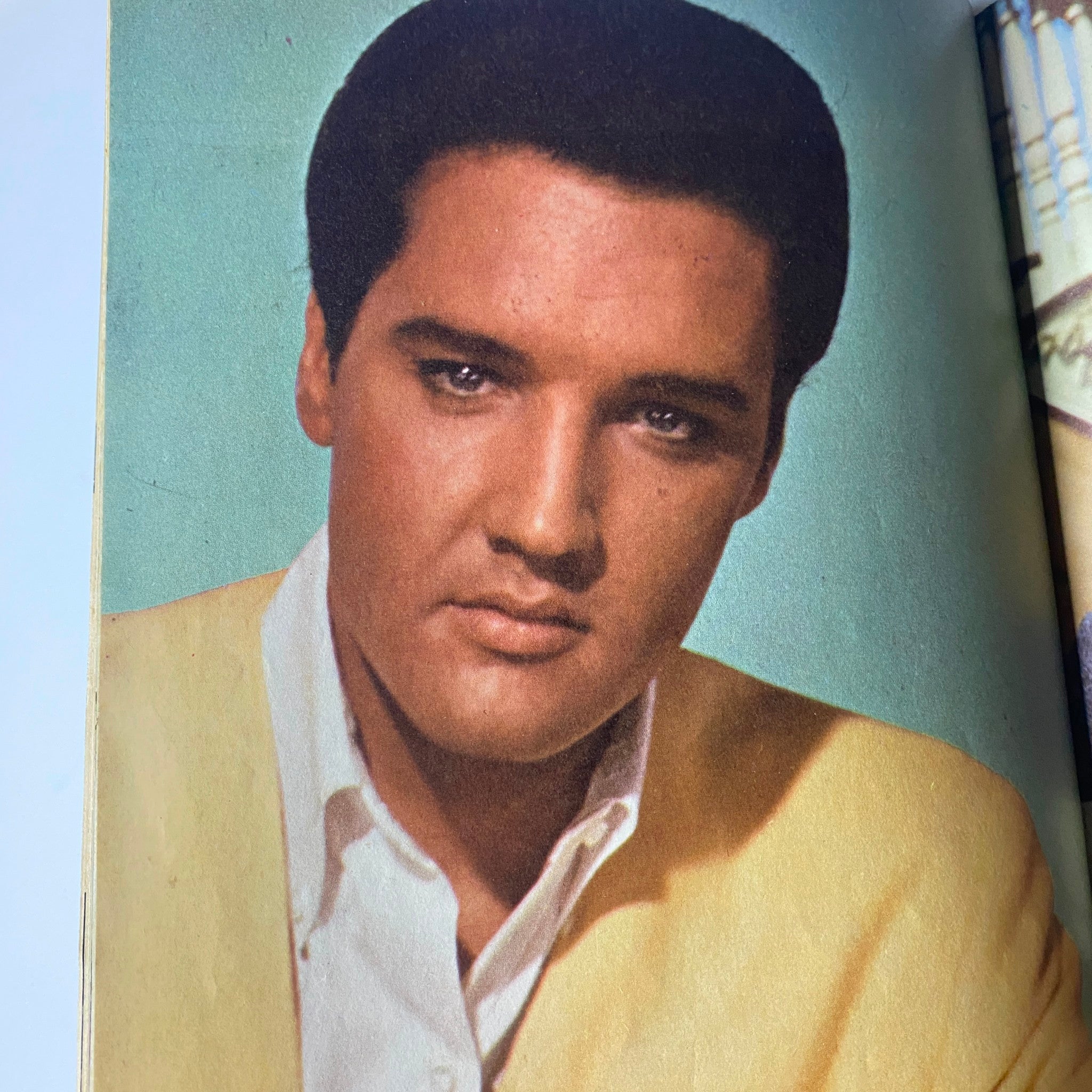 Close-up image of Elvis Presley from Teen Screen Magazine May 1965, featuring him in a colorful portrait, symbolizing pop culture and nostalgia of the 1960s.