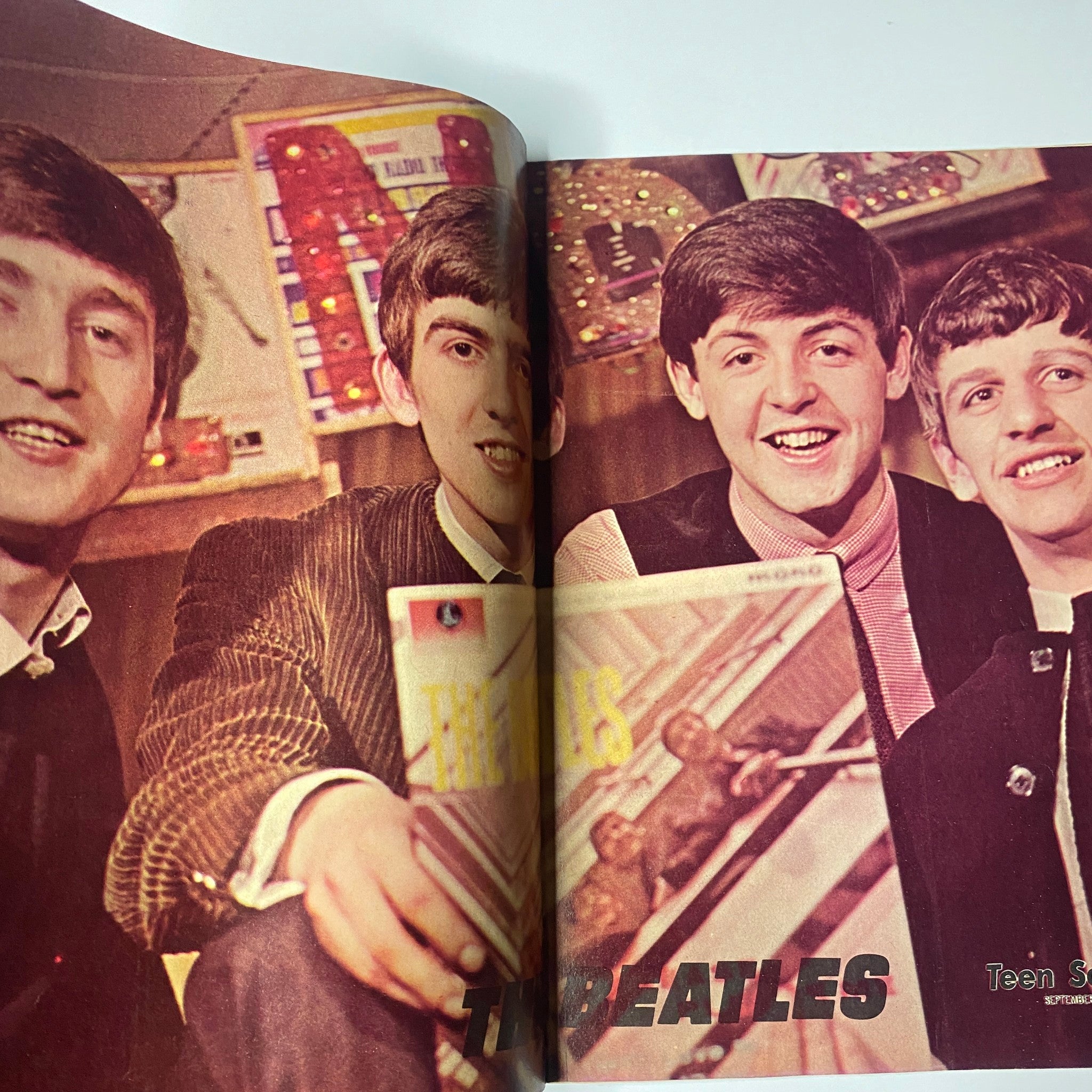 The Beatles featured in Teen Screen Magazine September 1964, showcasing their vibrant personalities and Beatlemania era charm.