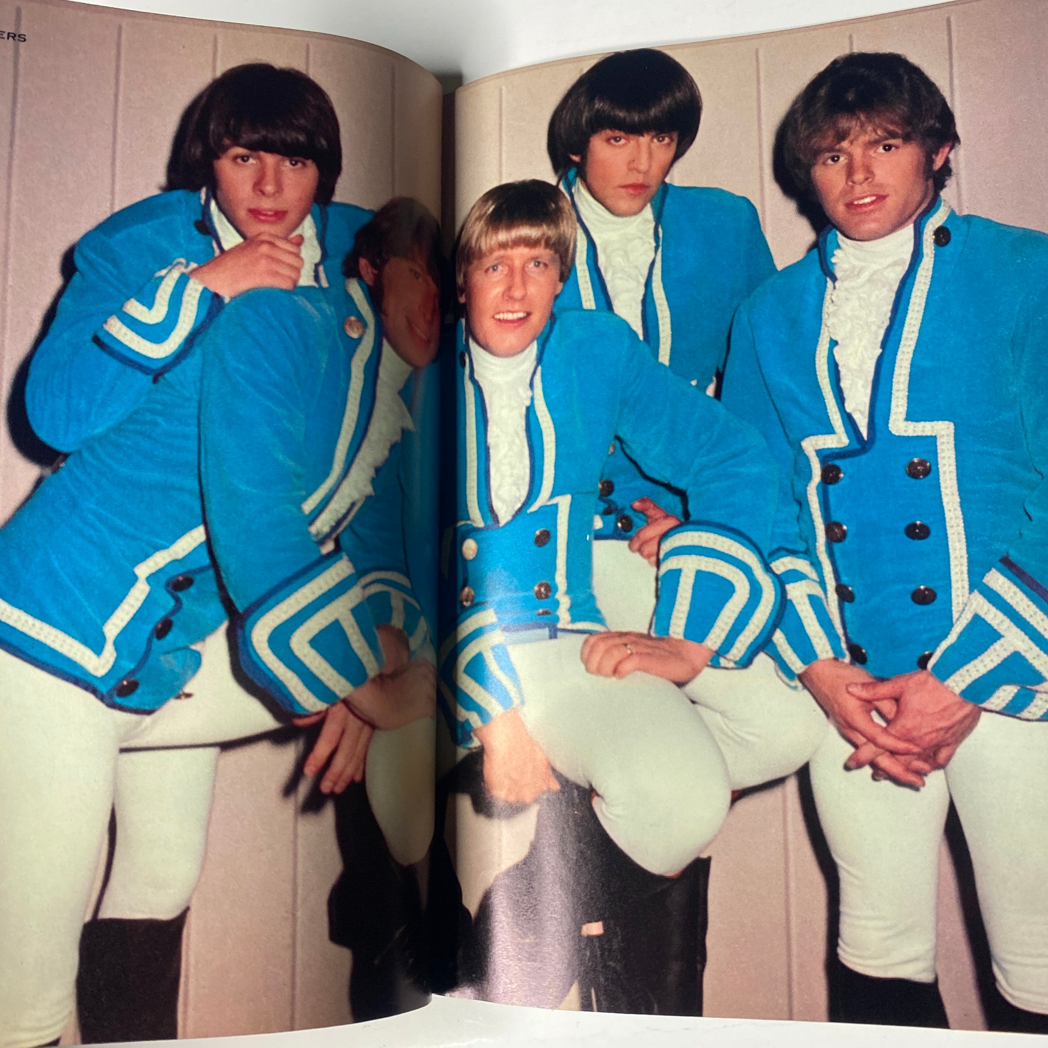 Group photo of The Monkees in distinctive blue jackets from Teen Set Magazine July 1967.