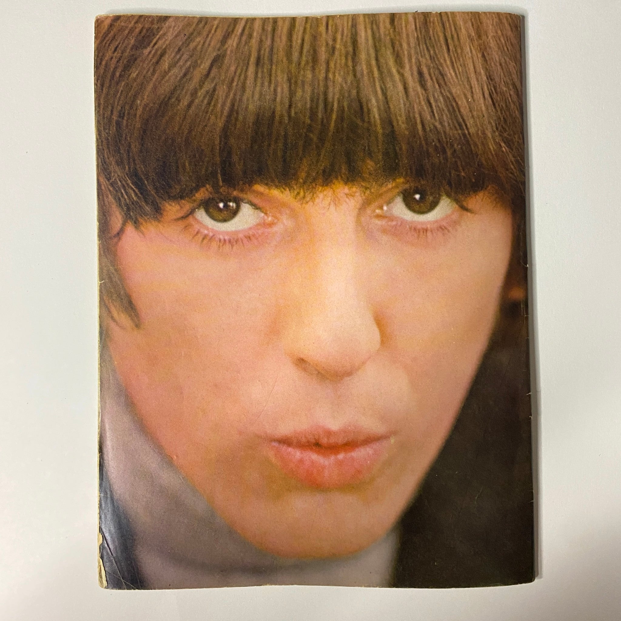 Close-up portrait of George Harrison with a distinctive hairstyle, featured in the 1965 16 Scoop: Beatles Complete Story from Birth to Now w Poster No Label magazine, capturing the essence of the Fab Four's early career.