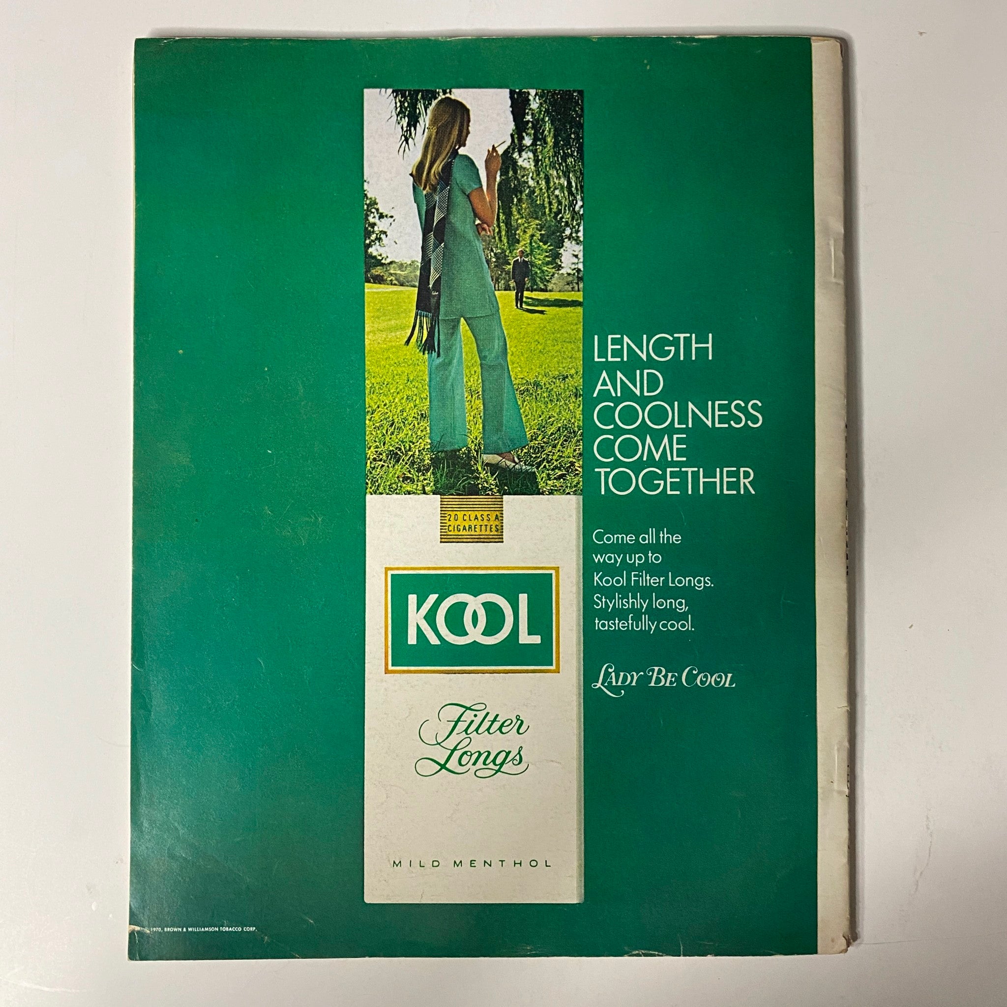 Vintage advertisement for Kool Filter Longs, highlighting the connection of length and coolness, presented in the August 1970 issue of Modern Screen Magazine with a stylish woman in trendy attire.
