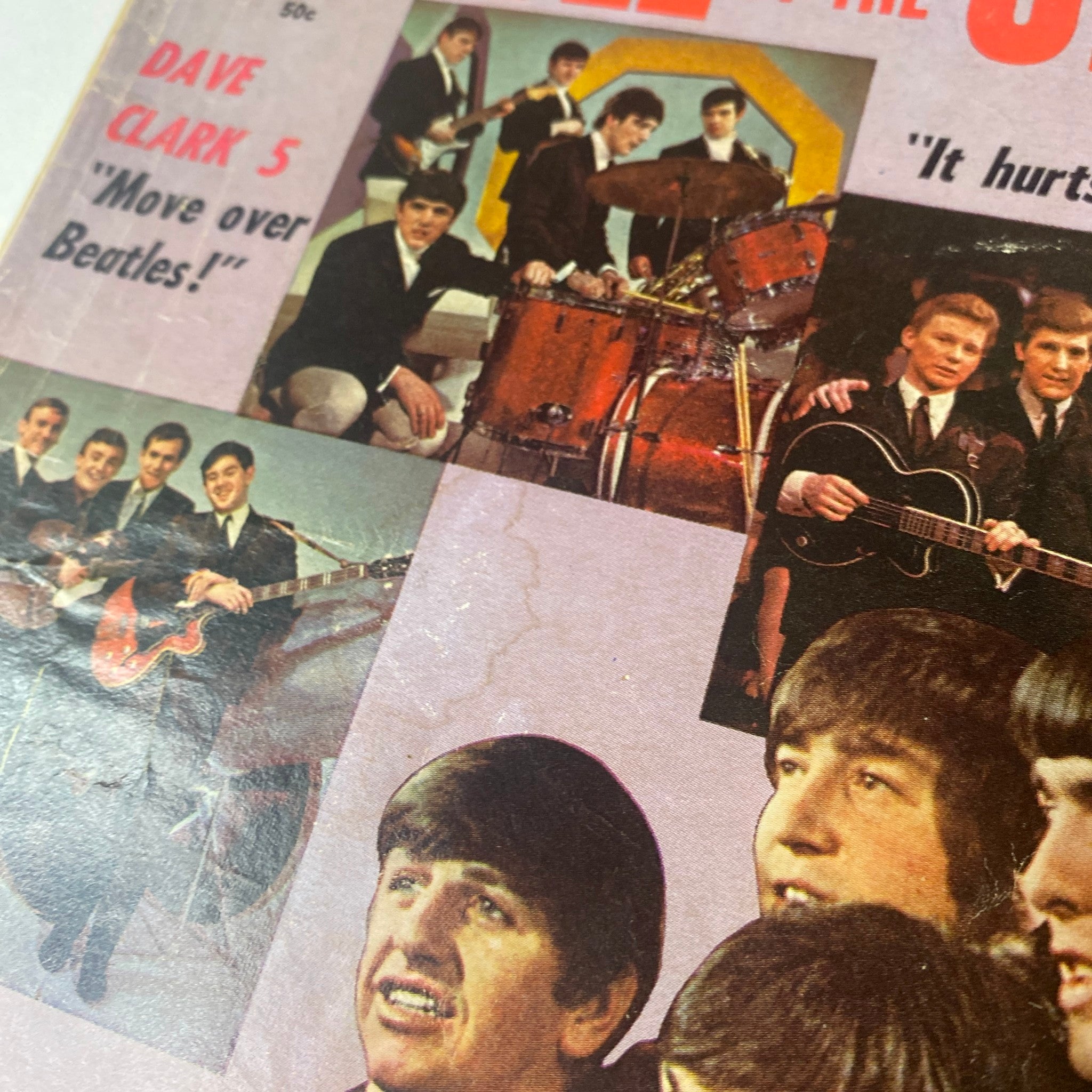 Close-up of Modern Annual Magazine 1964 Vol 1 No. 1 cover featuring The Beatles, with promotional text discussing The Dave Clark Five and the excitement surrounding the rivalry with the Beatles.