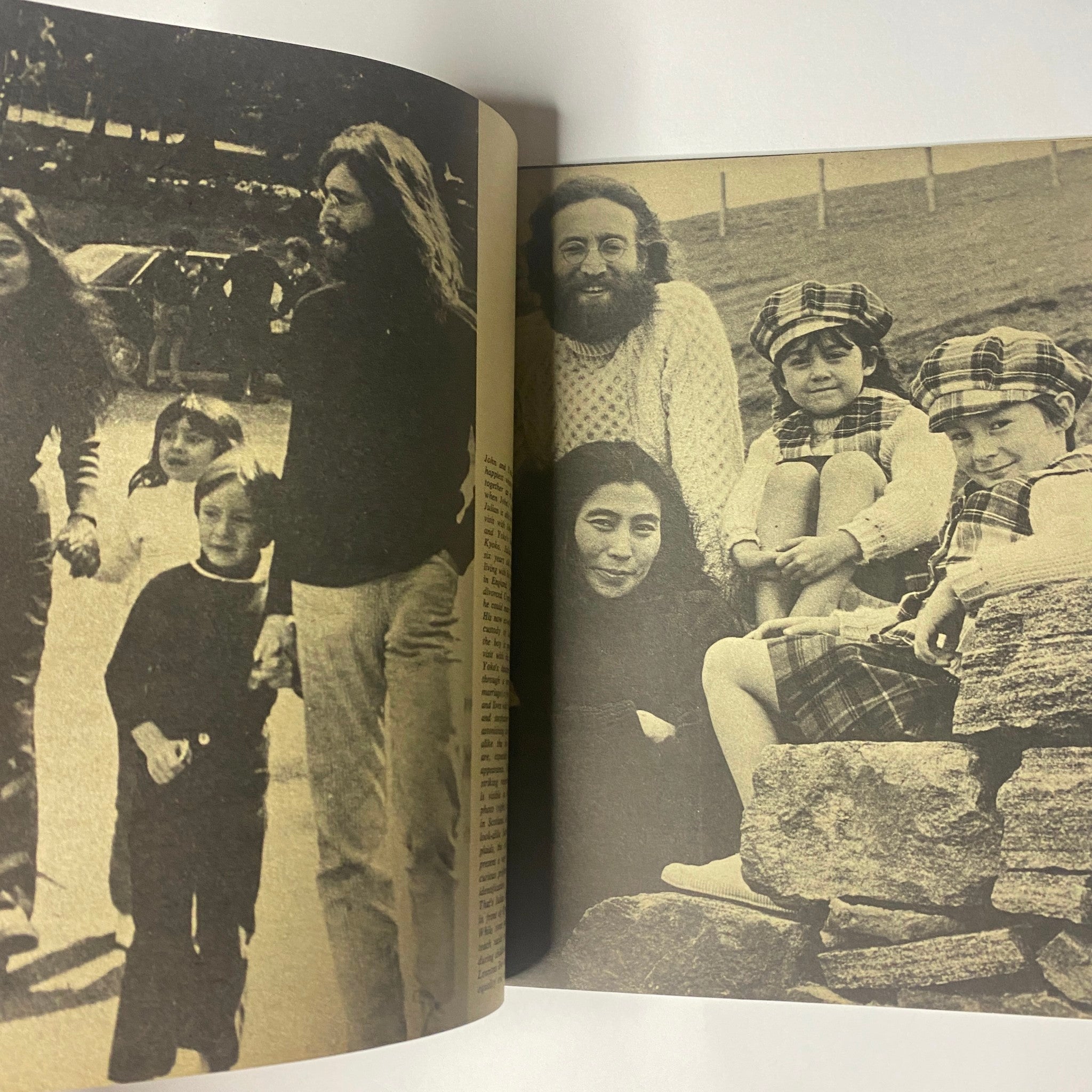 Interior page of 'Beatles Special John Lennon and Yoko Ono Their Love Book Collector's Edition', displaying a historic photograph of John Lennon, Yoko Ono, and children, emphasizing family and togetherness.