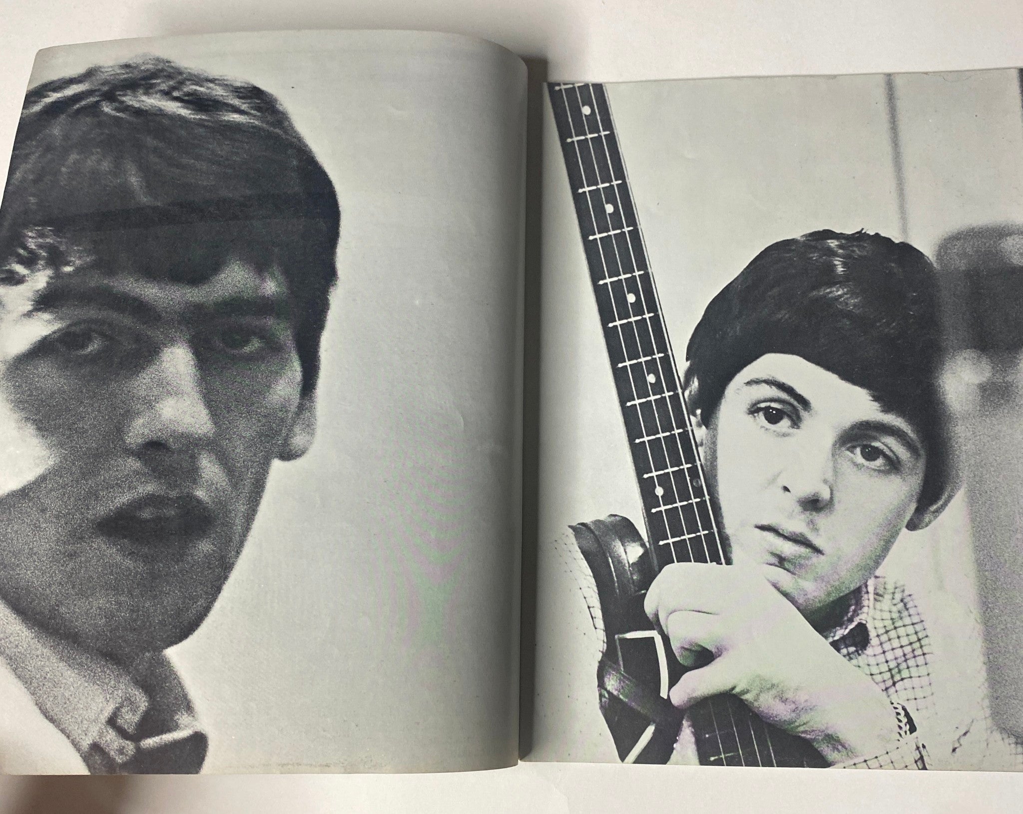 1964 The Beatles by Norman Parkinson Pictures for Framing No Label, showcasing a close-up black-and-white image of Paul McCartney with a bass guitar and George Harrison in a reflective moment, highlighting their youthful expressions.