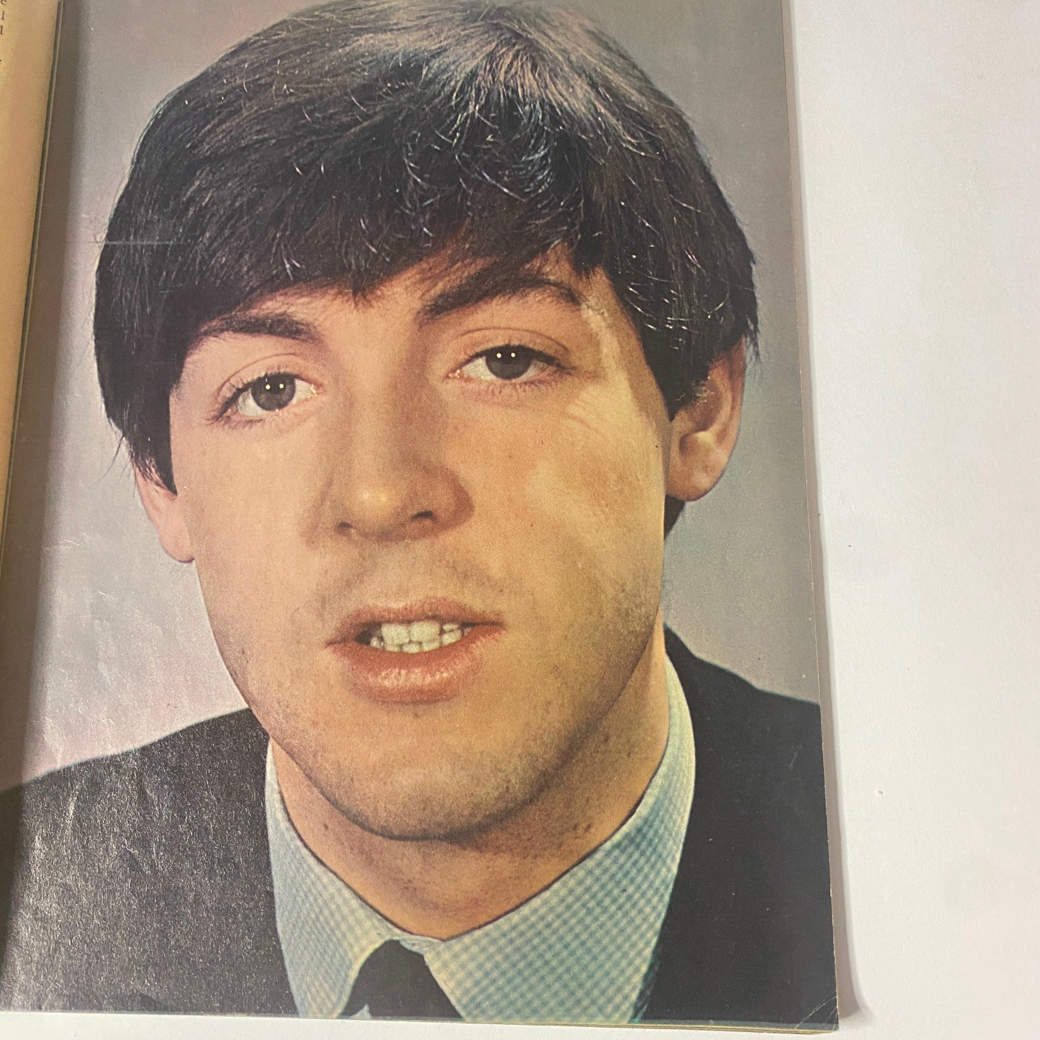 Close-up portrait of Paul McCartney featured in Teen Screen Magazine 1964 The Beatles Color Pinup Album, showcasing the iconic looks of The Beatles.