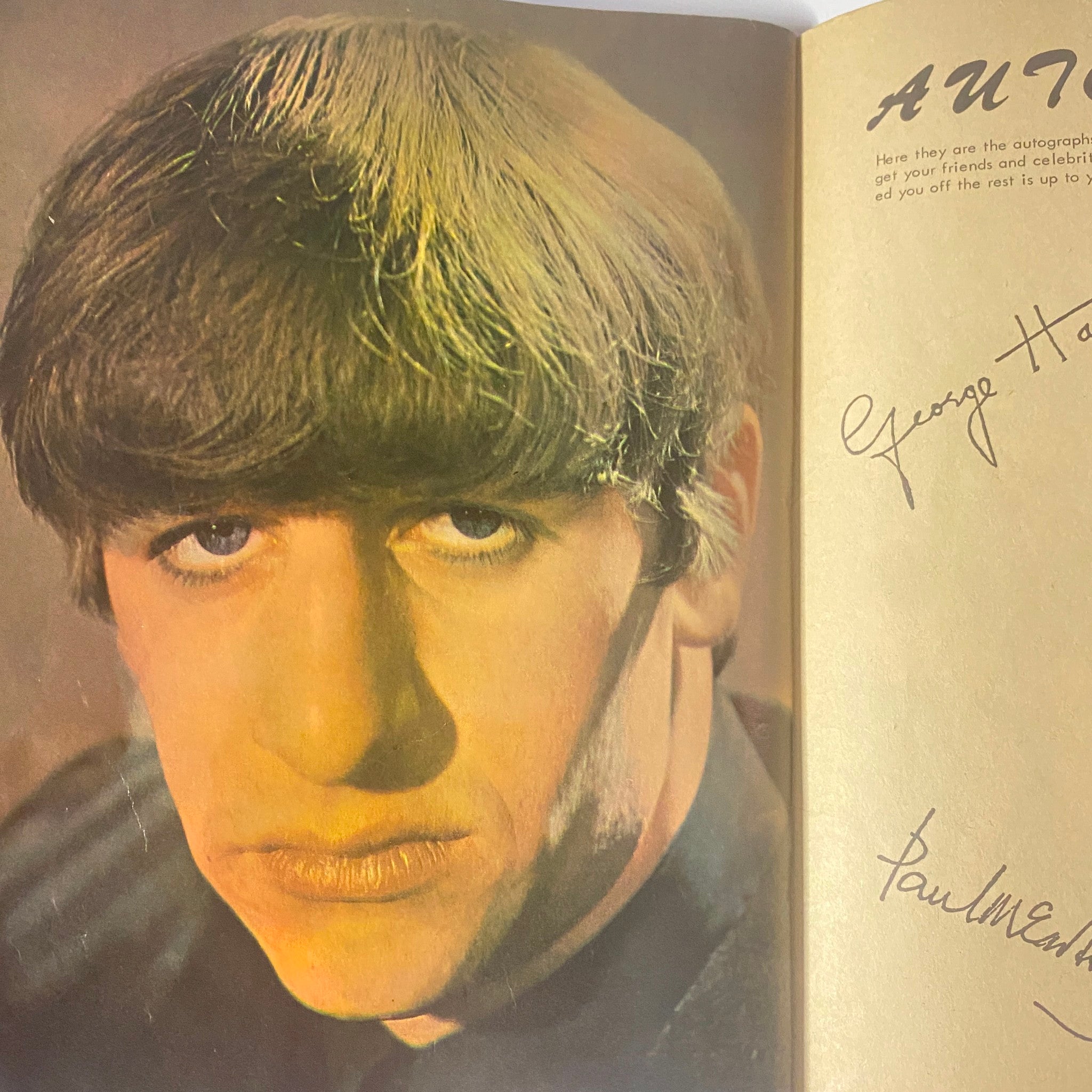 George Harrison’s portrait enclosed in Teen Screen Magazine 1964 The Beatles Color Pinup Album, with stylish autographs from The Beatles.