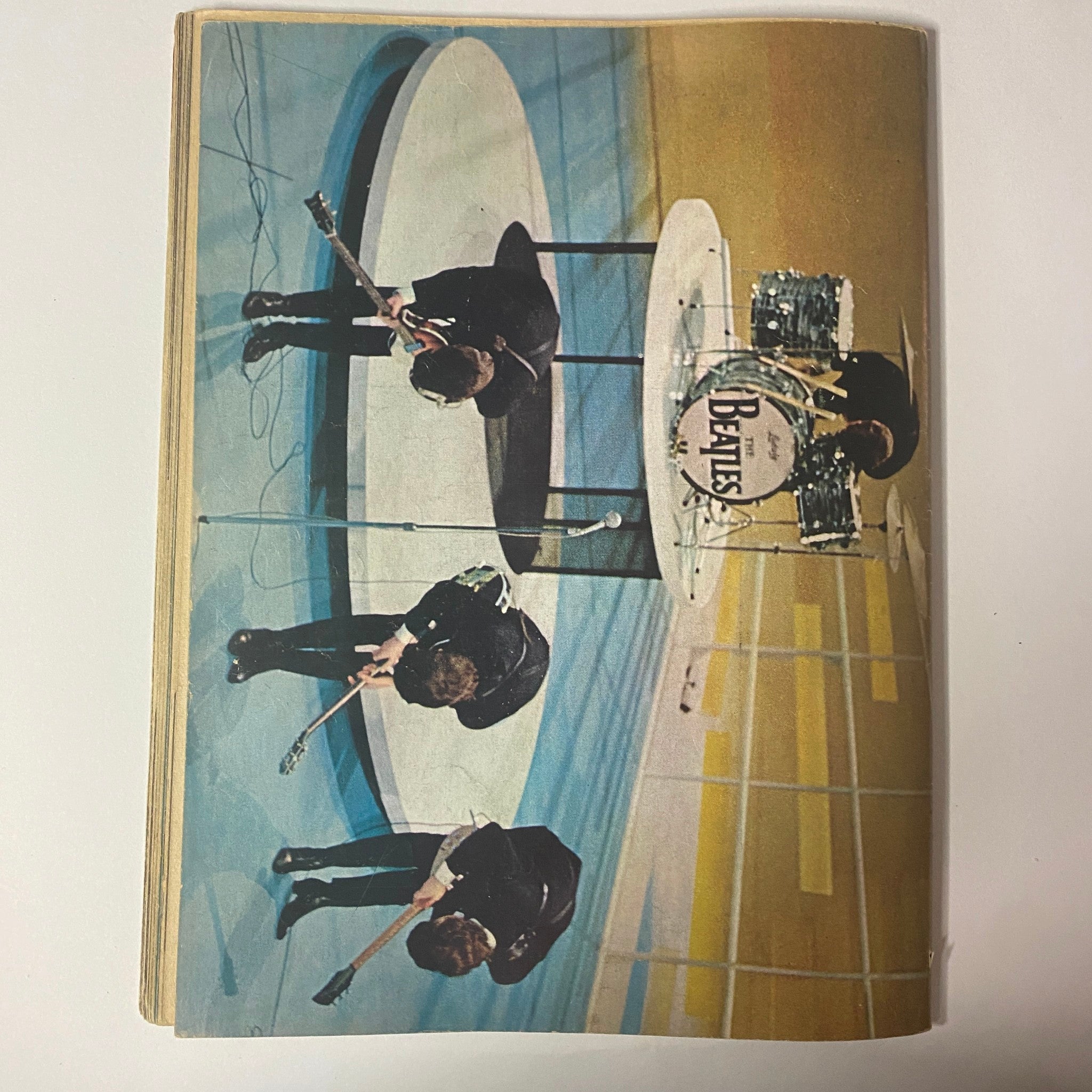 Teen Screen Magazine 1964 The Beatles Color Pinup Album featuring a vibrant image of The Beatles performing, showcasing their iconic style and stage presence, perfect for fans and collectors.
