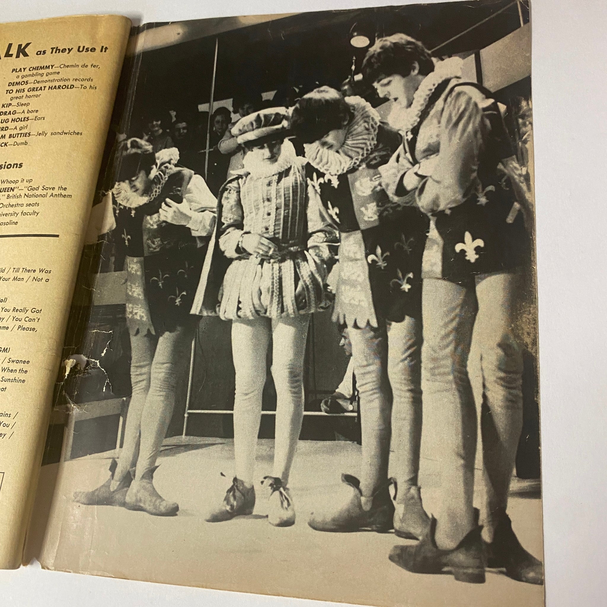 Interior page from '1964 The Real True Beatles Number One' by Michael Braun showing The Beatles in theatrical costumes, highlighting their dynamic presence in the entertainment industry.