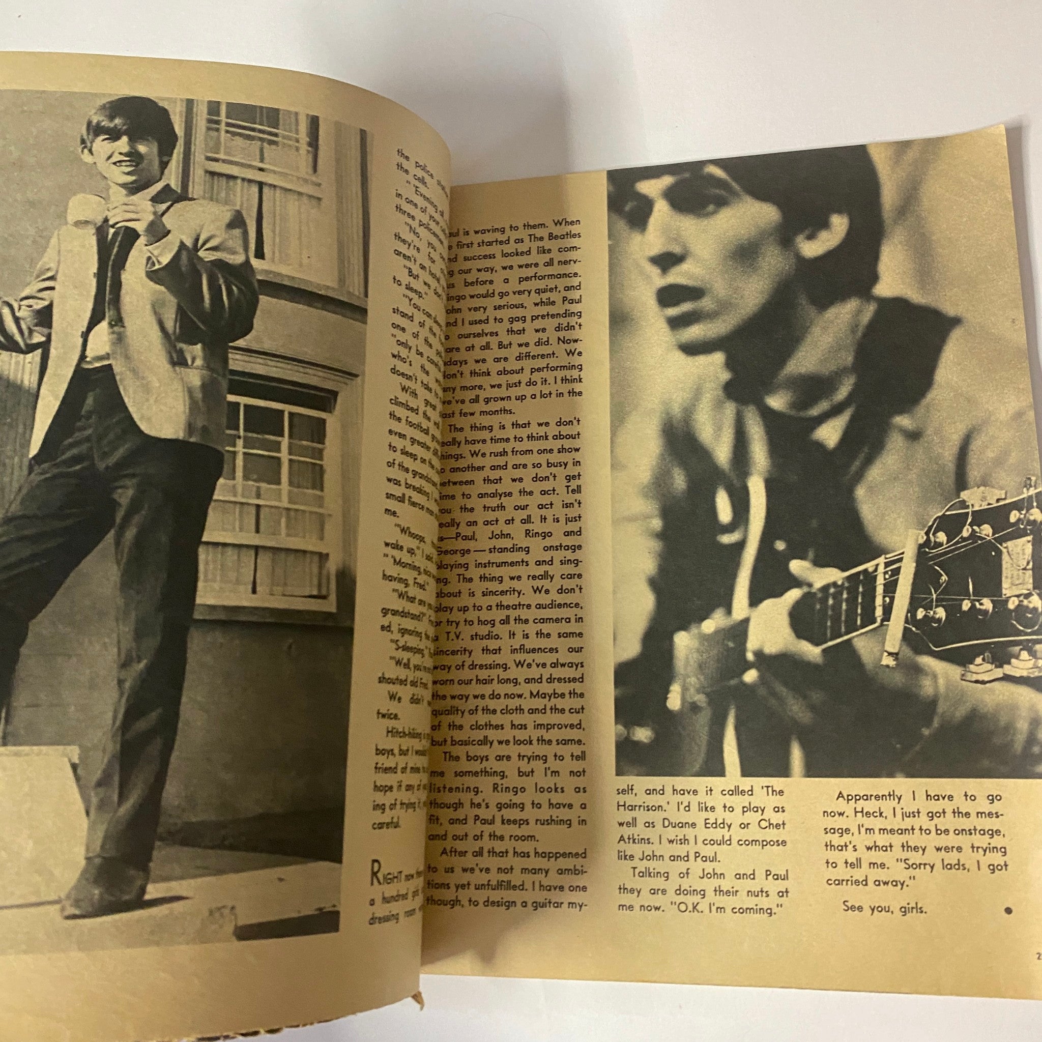 Interior image from 1964 All About The Beatles No. 1 magazine, featuring George Harrison in a stylish suit, showcasing a candid moment.