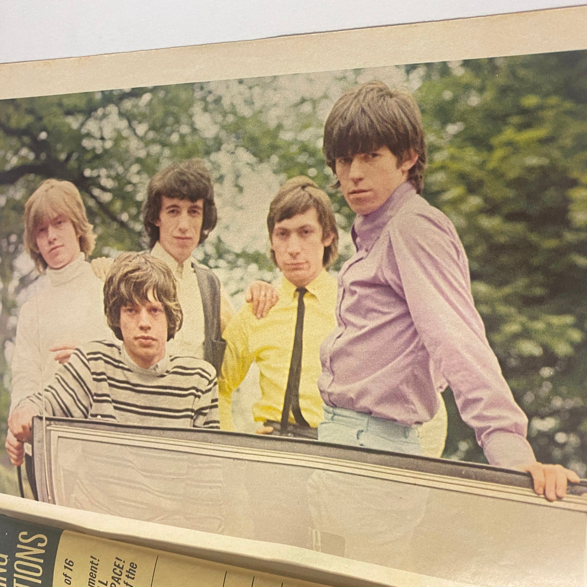 The Rolling Stones in 16 Magazine October 1964 Vol 6 No. 5, presenting five band members in a colorful outdoor setting, reflecting the vibrant 1960s music scene.
