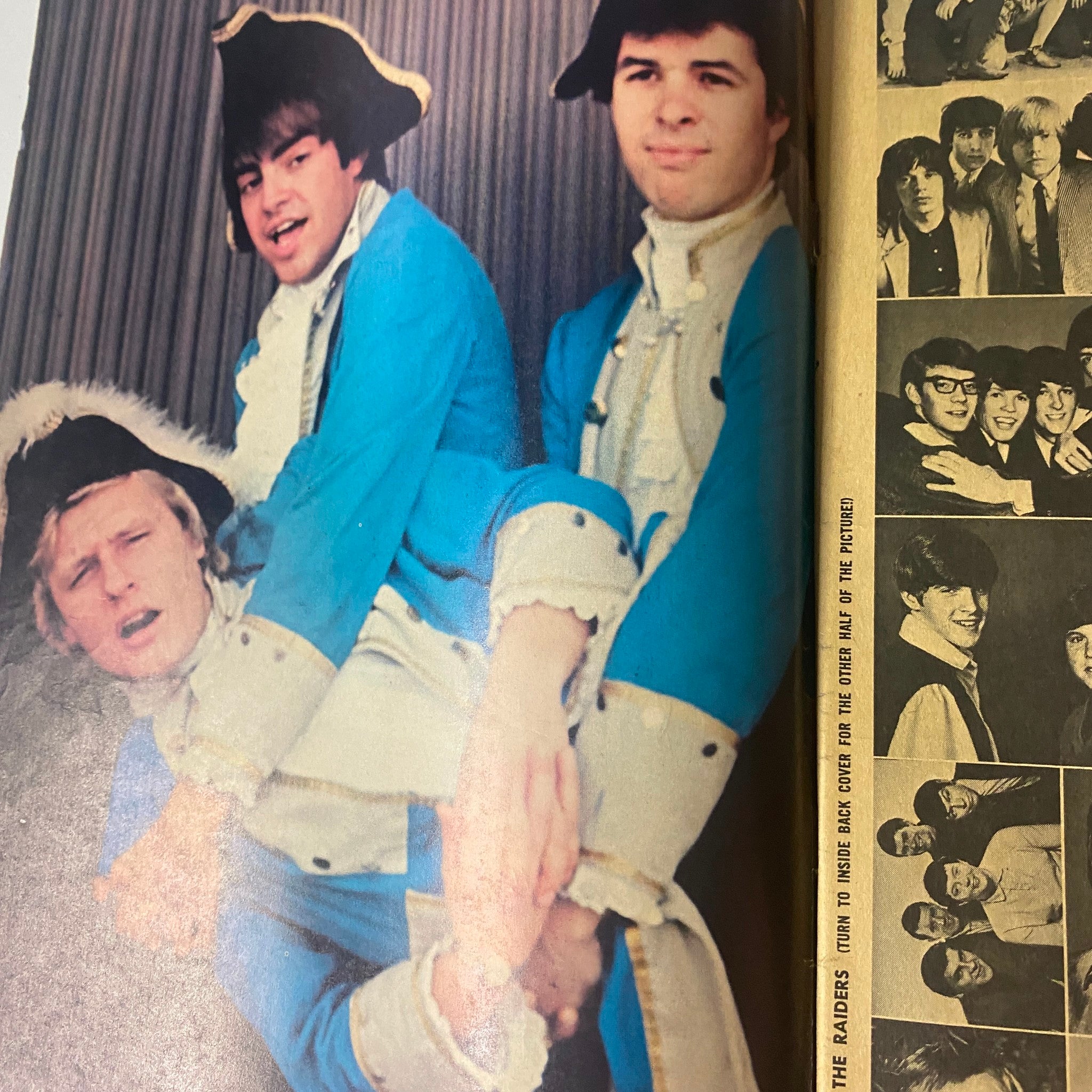 Color photo from 16 Magazine January 1966 Vol 7 No. 8 showing a playful pose by members of Paul Revere & The Raiders.