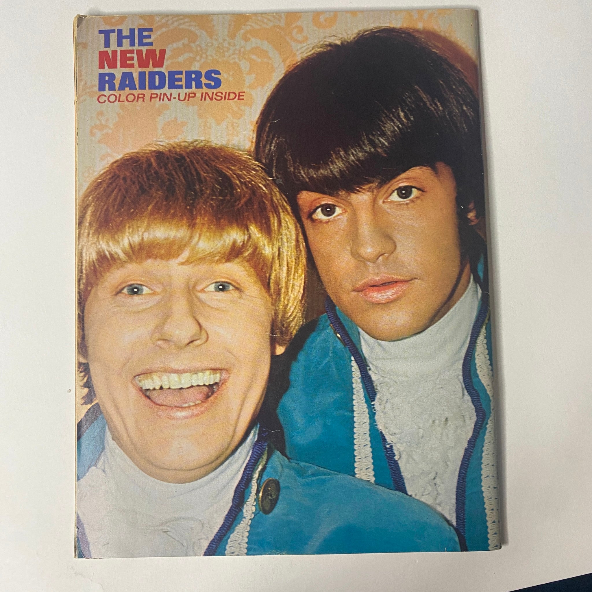 Cover image of 16 Magazine August 1967 Vol 9 No. 3, titled 'The New Raiders' with vibrant colors. The cover features two men in elaborate outfits, representing the teen idol culture of the 1960s.