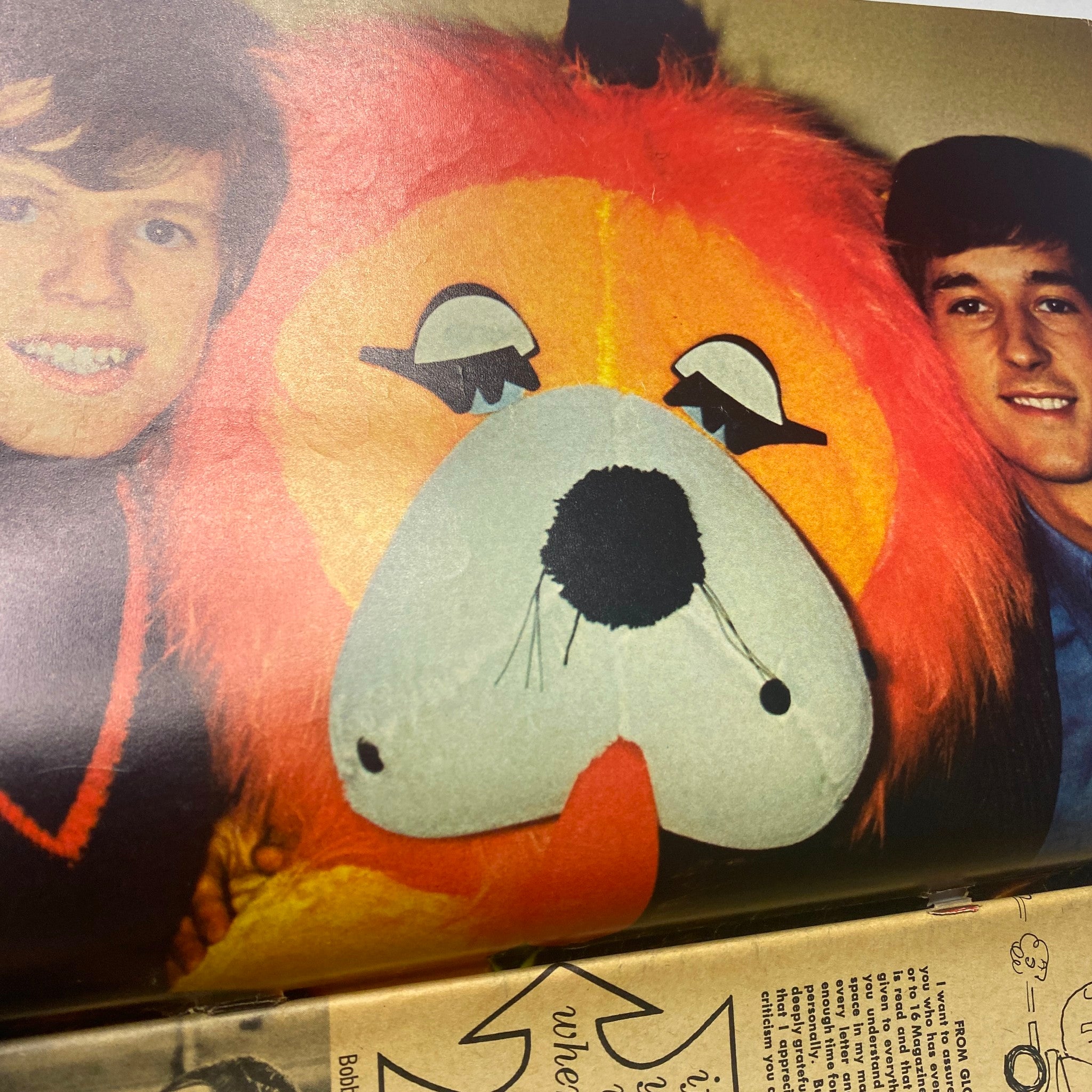 Inside image from 16 Magazine July 1966 showing a young boy with a large lion mascot, capturing the playful essence of the magazine's content and the lively atmosphere of the 1960s music scene.