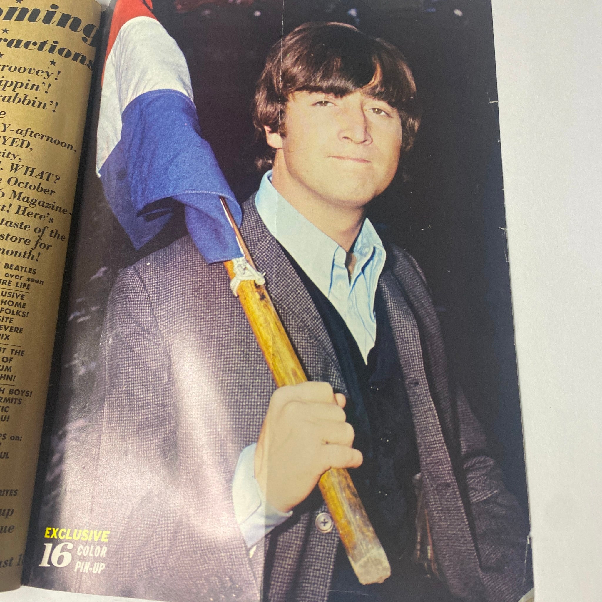 John Lennon holding a flag in a featured color pin-up from 16 Magazine – September 1966 – Vol. 8, No. 4 with Ringo Starr.