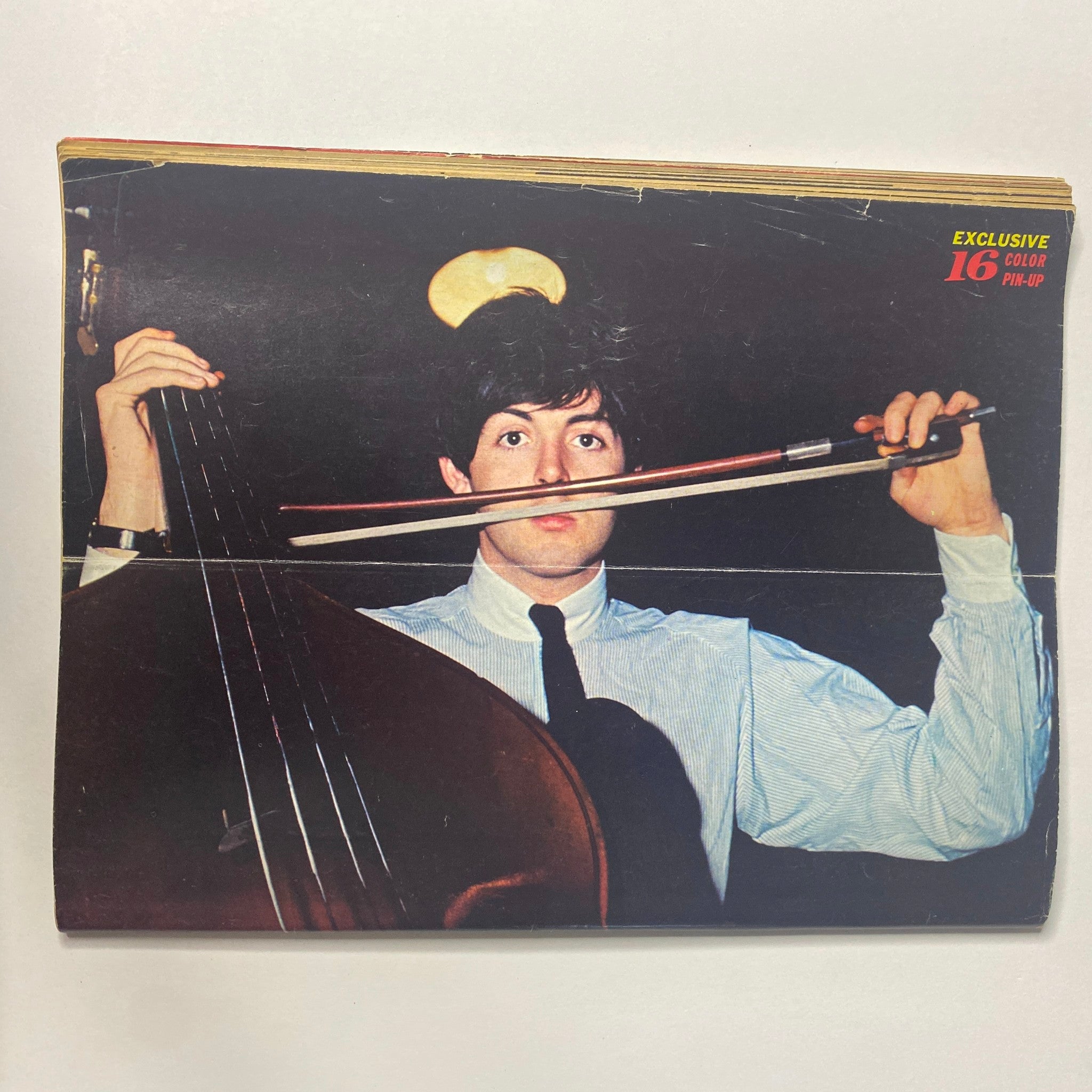 Paul McCartney playing the cello in a color pin-up from 16 Magazine – September 1966 – Vol. 8, No. 4 featuring Ringo Starr.