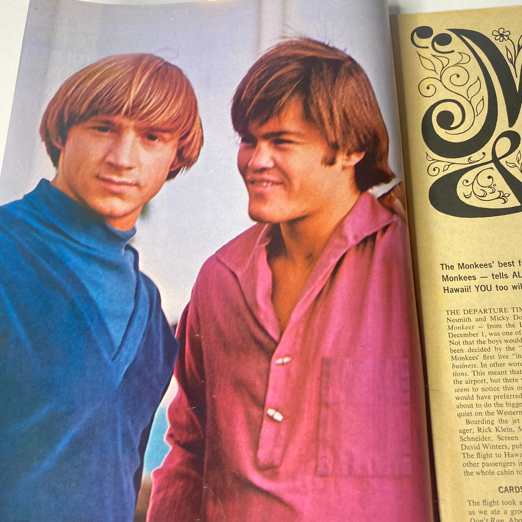 A colorful photograph of The Monkees, part of 16 Magazine April 1967 Vol 8 No. 11, showcasing Davy Jones and Peter Tork.