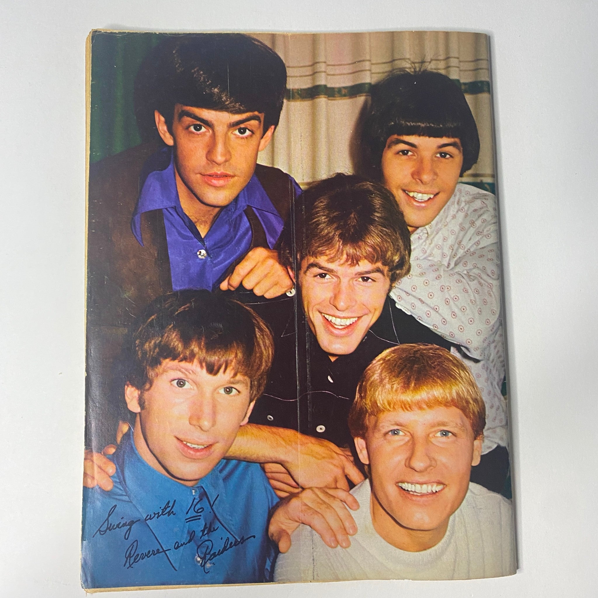 Group photo of The Monkees, featuring Davy Jones, Mike Nesmith, and other members, in 16 Magazine February 1967 Vol 8 No. 9, smiling and showcasing their 1960s style.