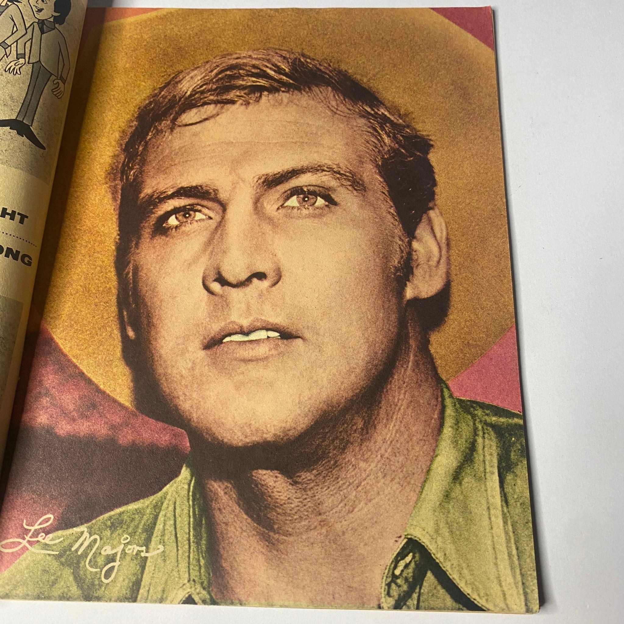 Portrait of Lee Majors in 16 Magazine March 1966 Vol 7 No. 10, showcasing a signed color pin-up with vibrant tones and striking expressions.