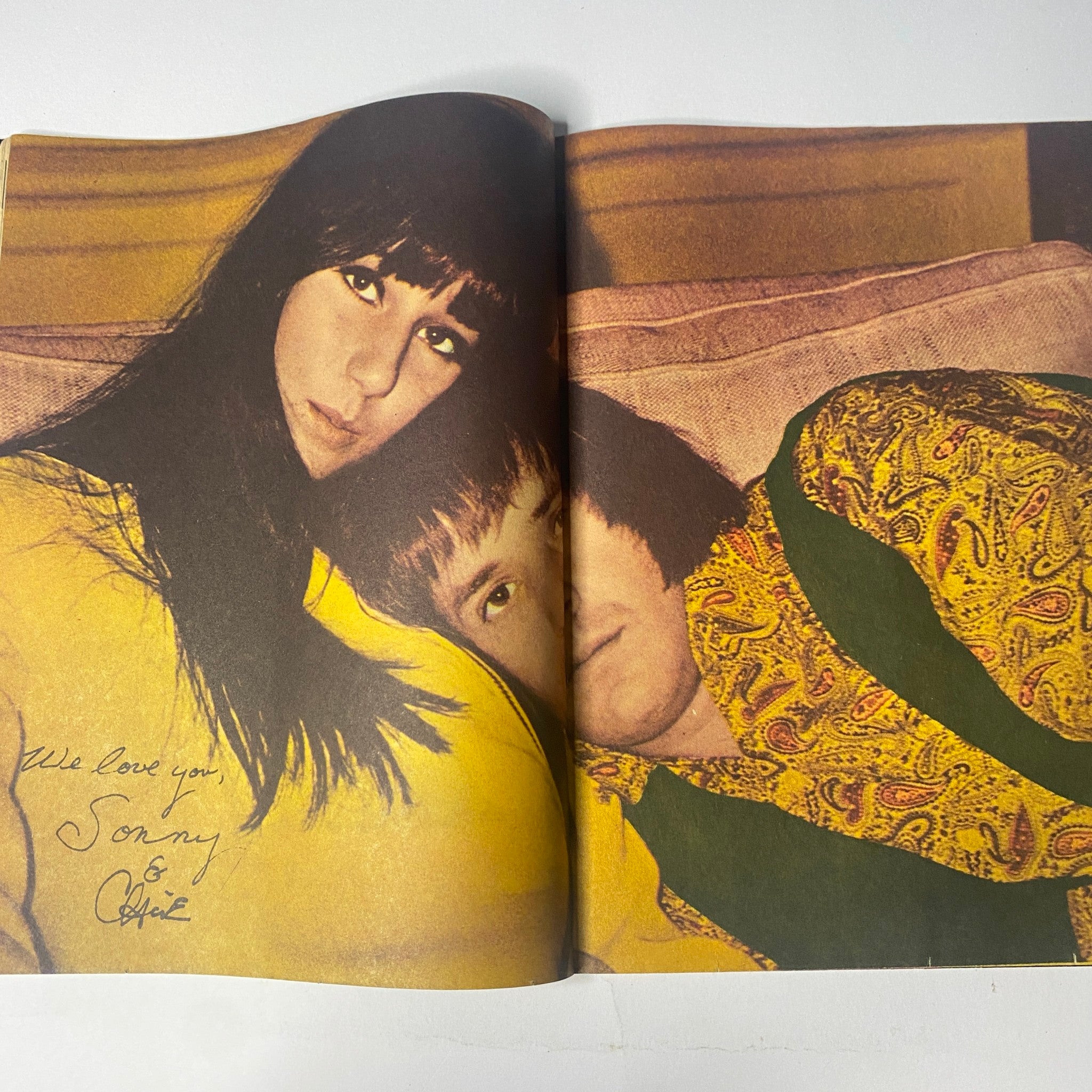 Dino, Desi & Billy featured in 16 Magazine March 1966, showing a signed color pin-up of Sonny & Cher, depicting a cozy moment on the couch.