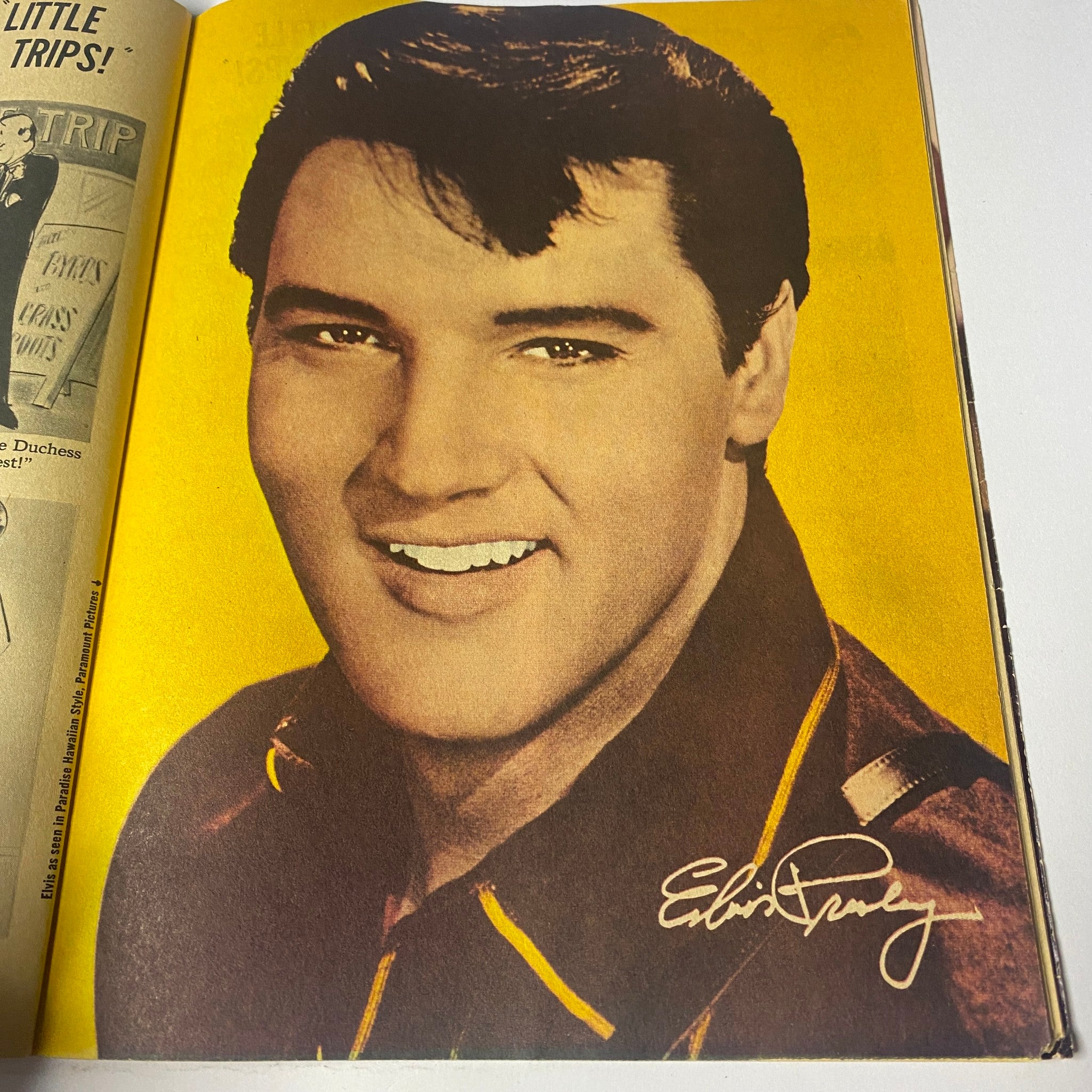 Elvis Presley in 16 Magazine March 1966, showcasing a vibrant portrait with his signature, reflecting the iconic style of the 1960s.