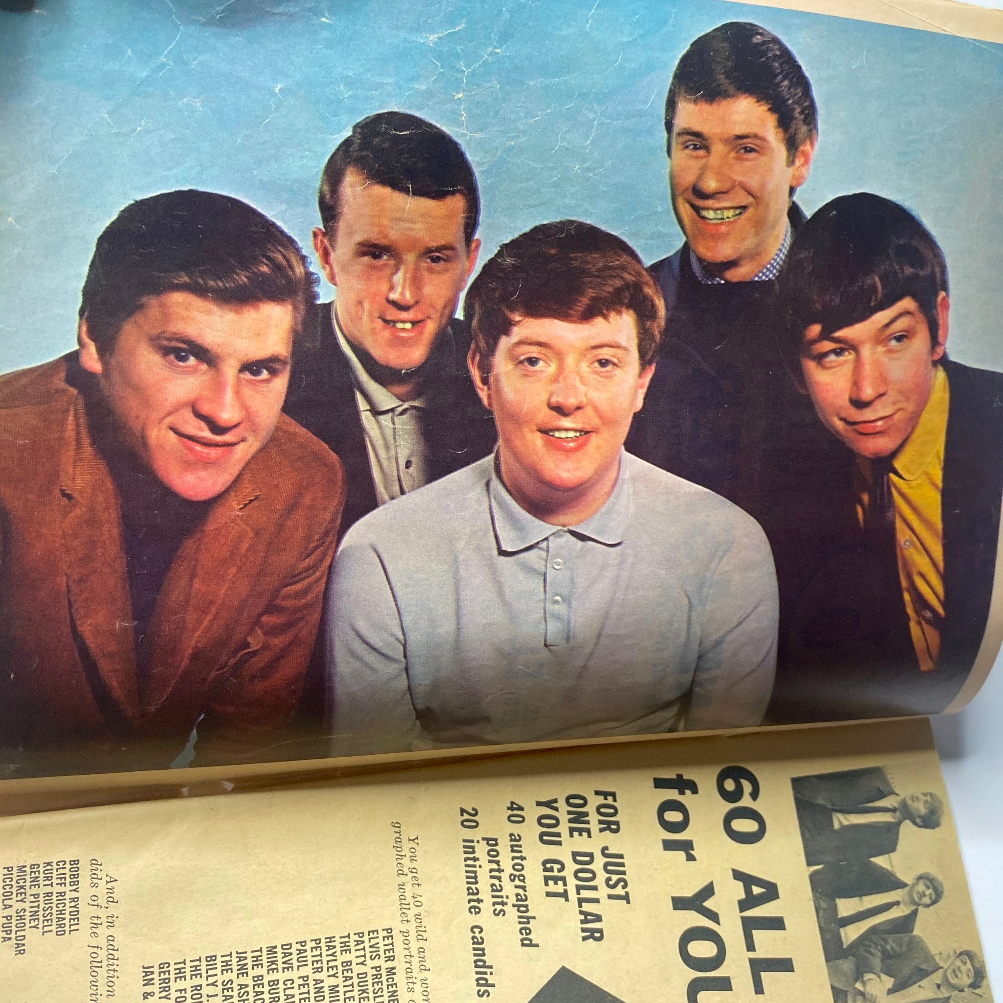 A photo of The Animals, an iconic band featured in 16 Magazine January 1965 Vol 6 No. 8, showcasing the group's members smiling in stylish attire.